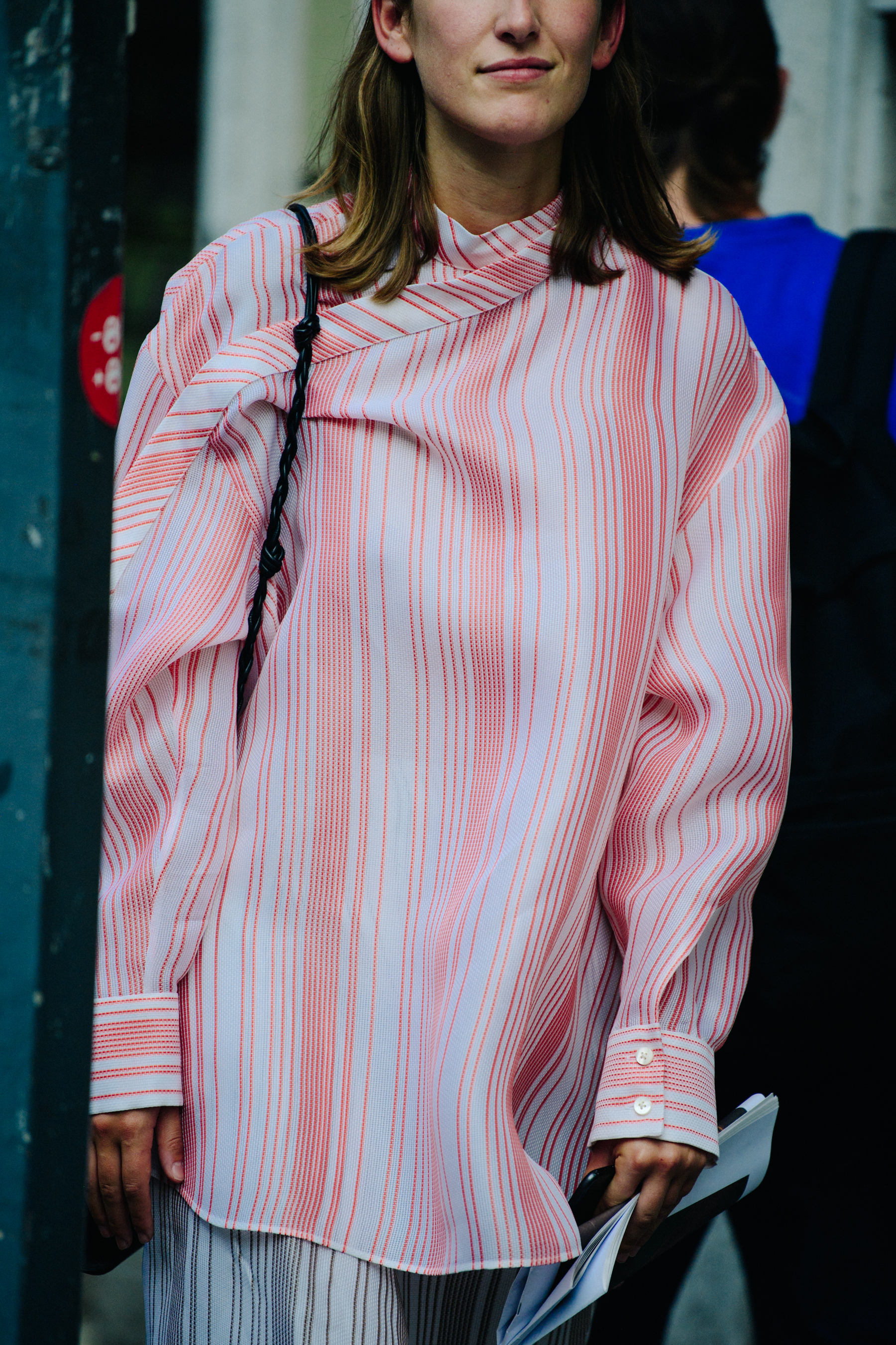 Woman wearing pink striped shirt