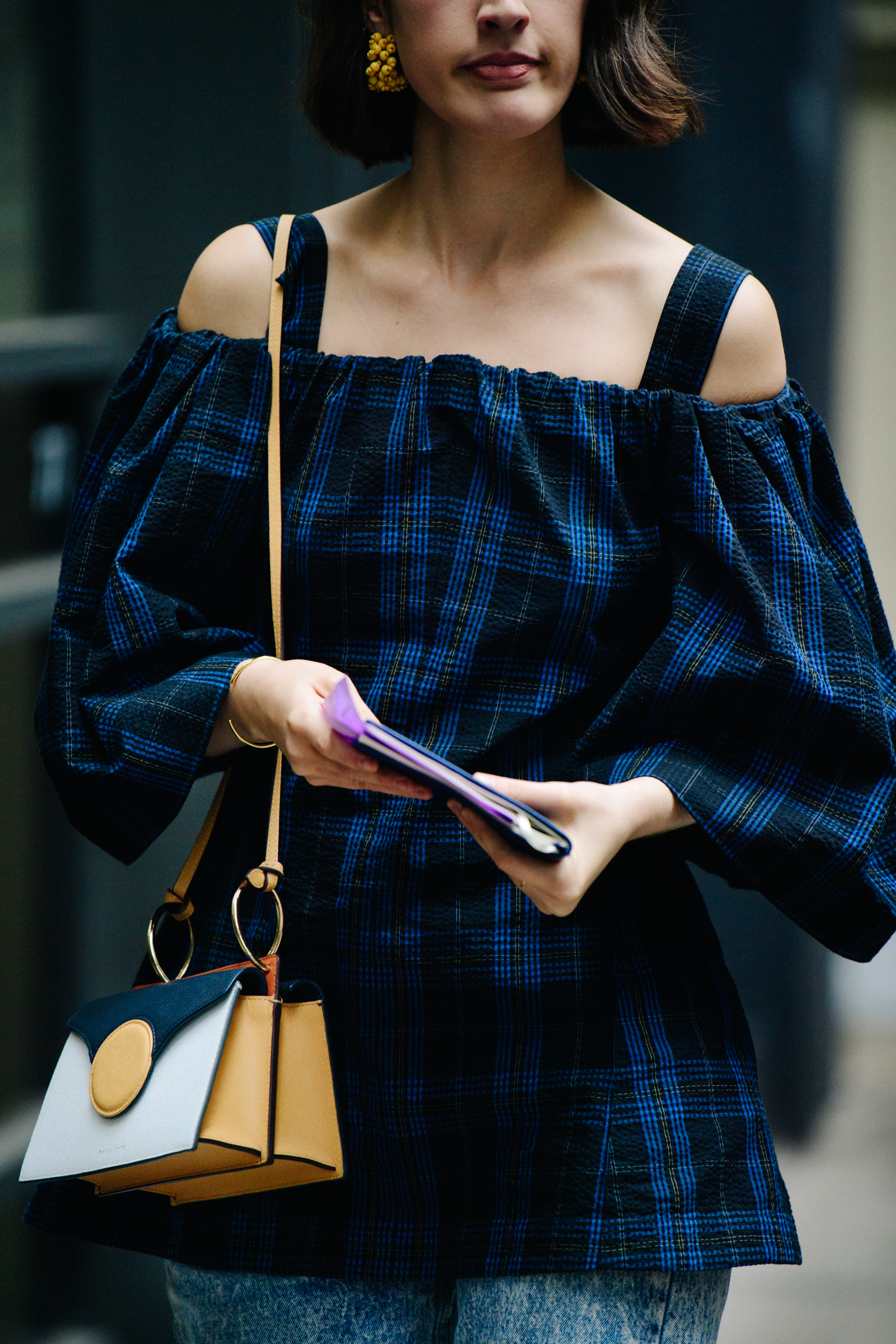 Woman wearing blue check top