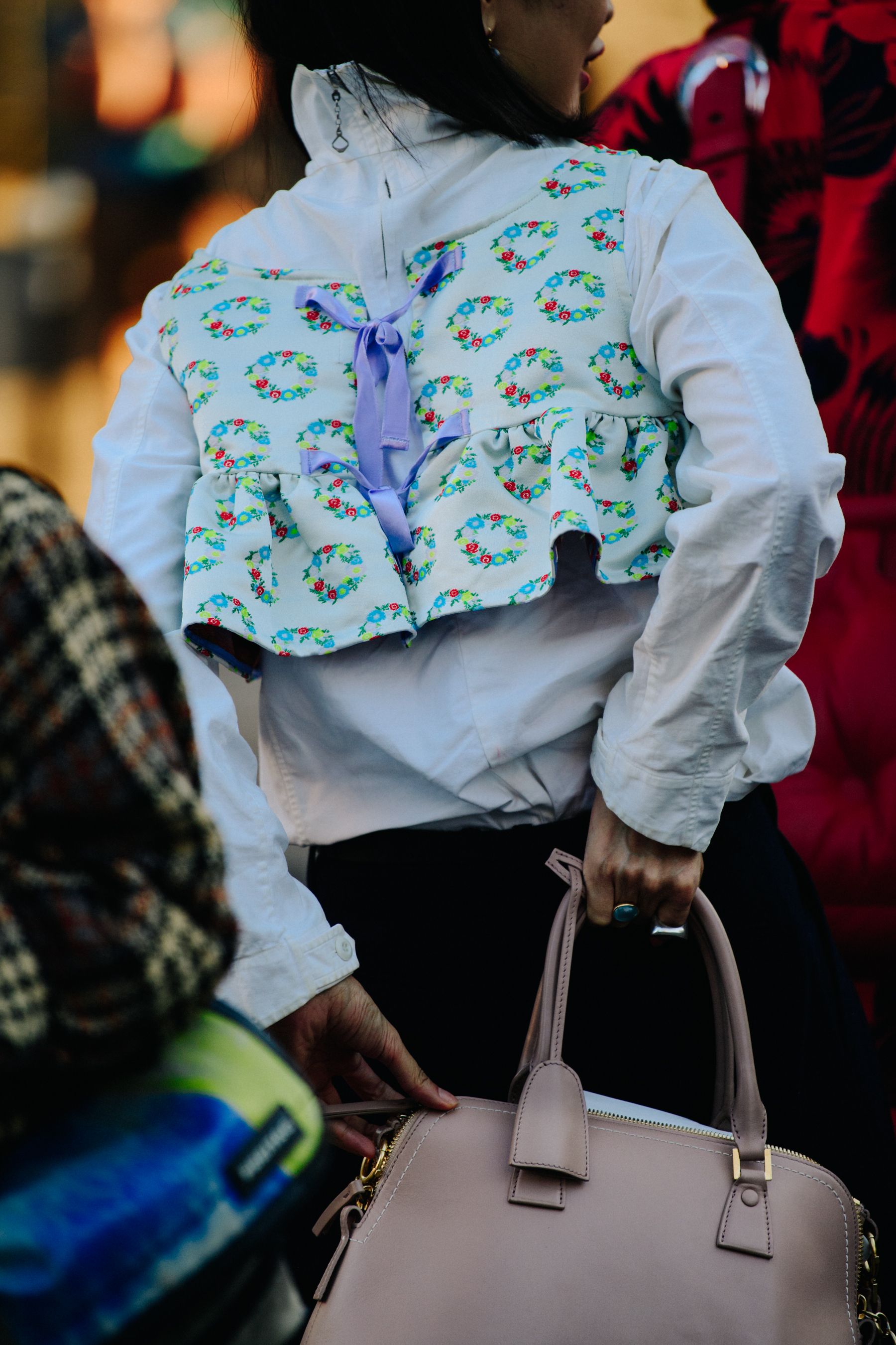 Woman wearing light floral jacket