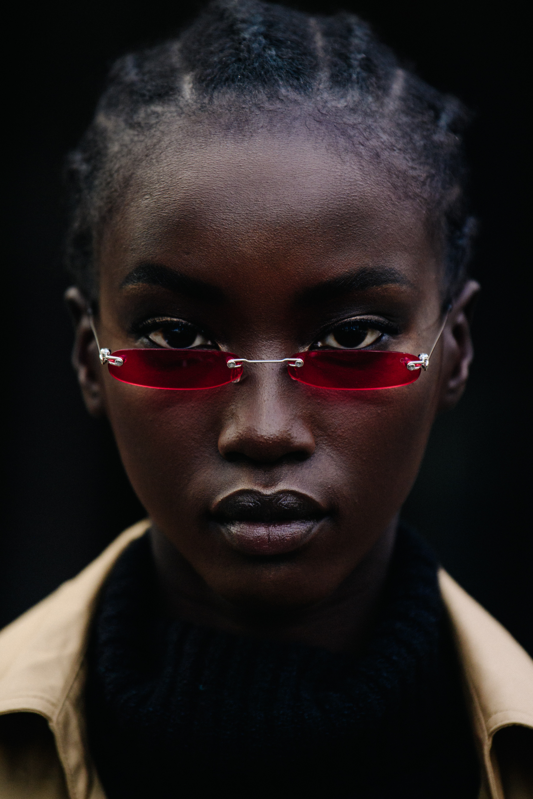 Portrait of model wearing red sunglasses
