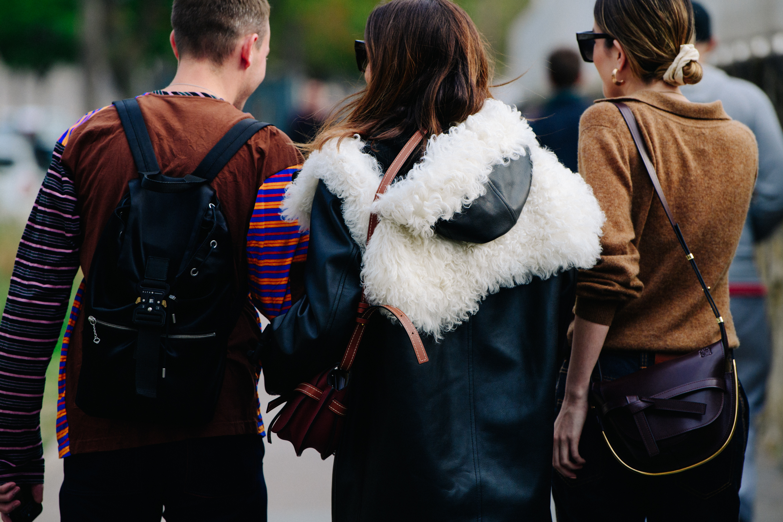 Three people wearing winter clothing