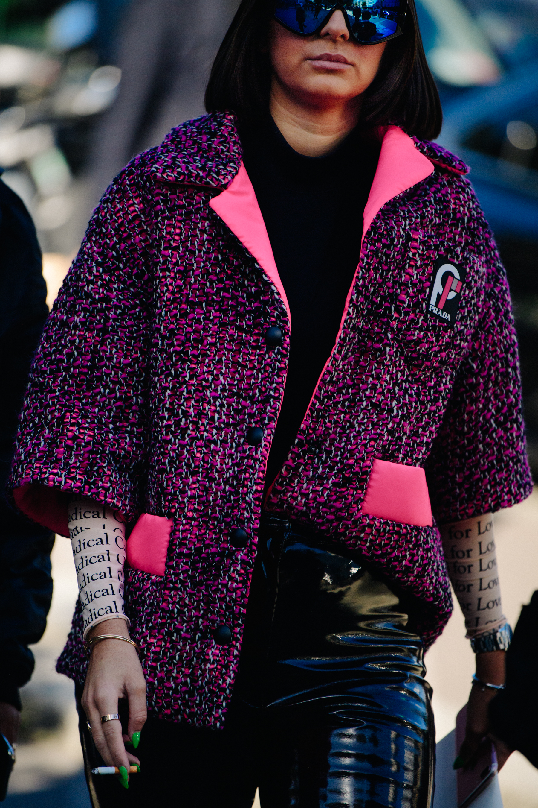 Woman wearing pink Prada jacket