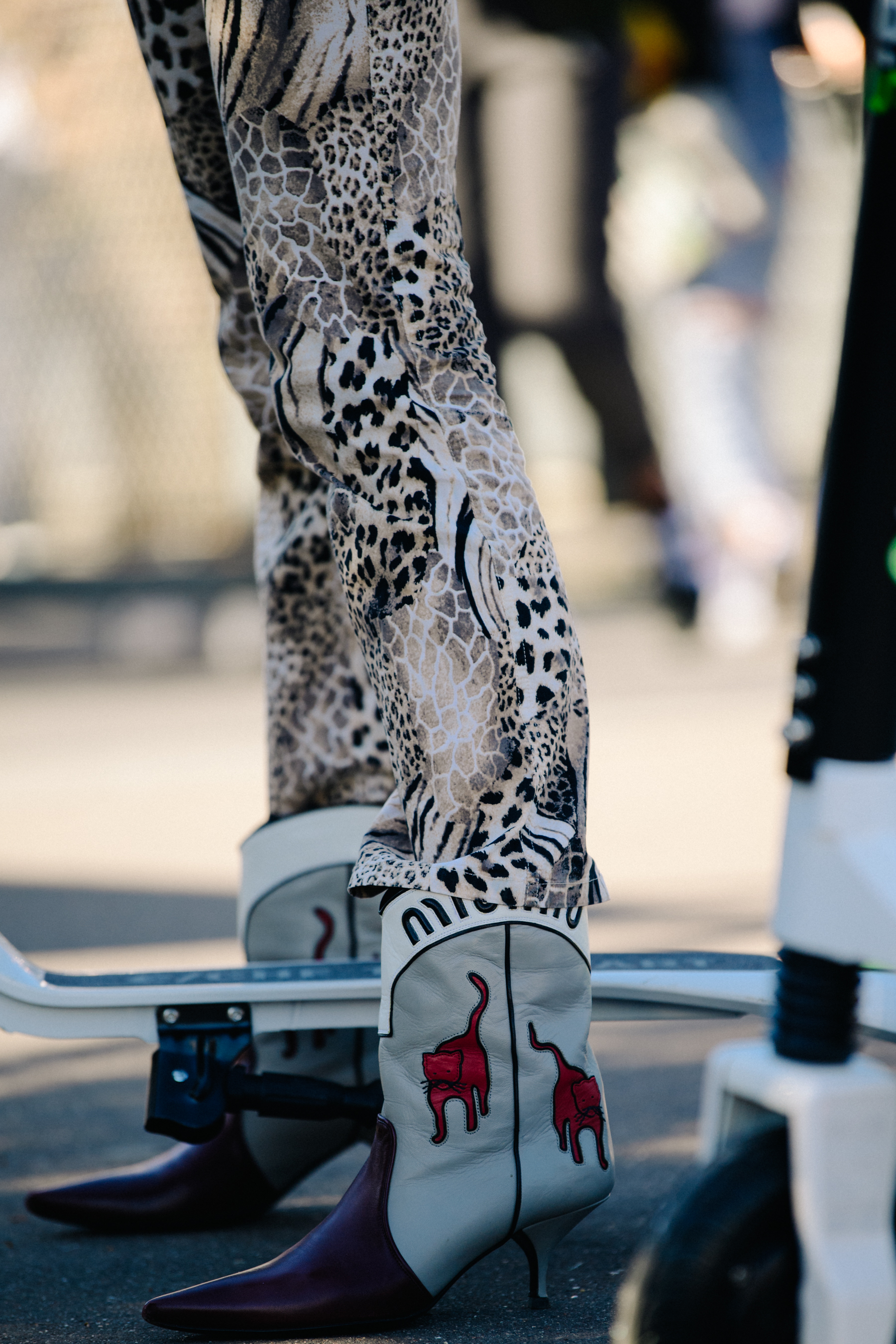 Woman wearing Miu Miu cowboy boots