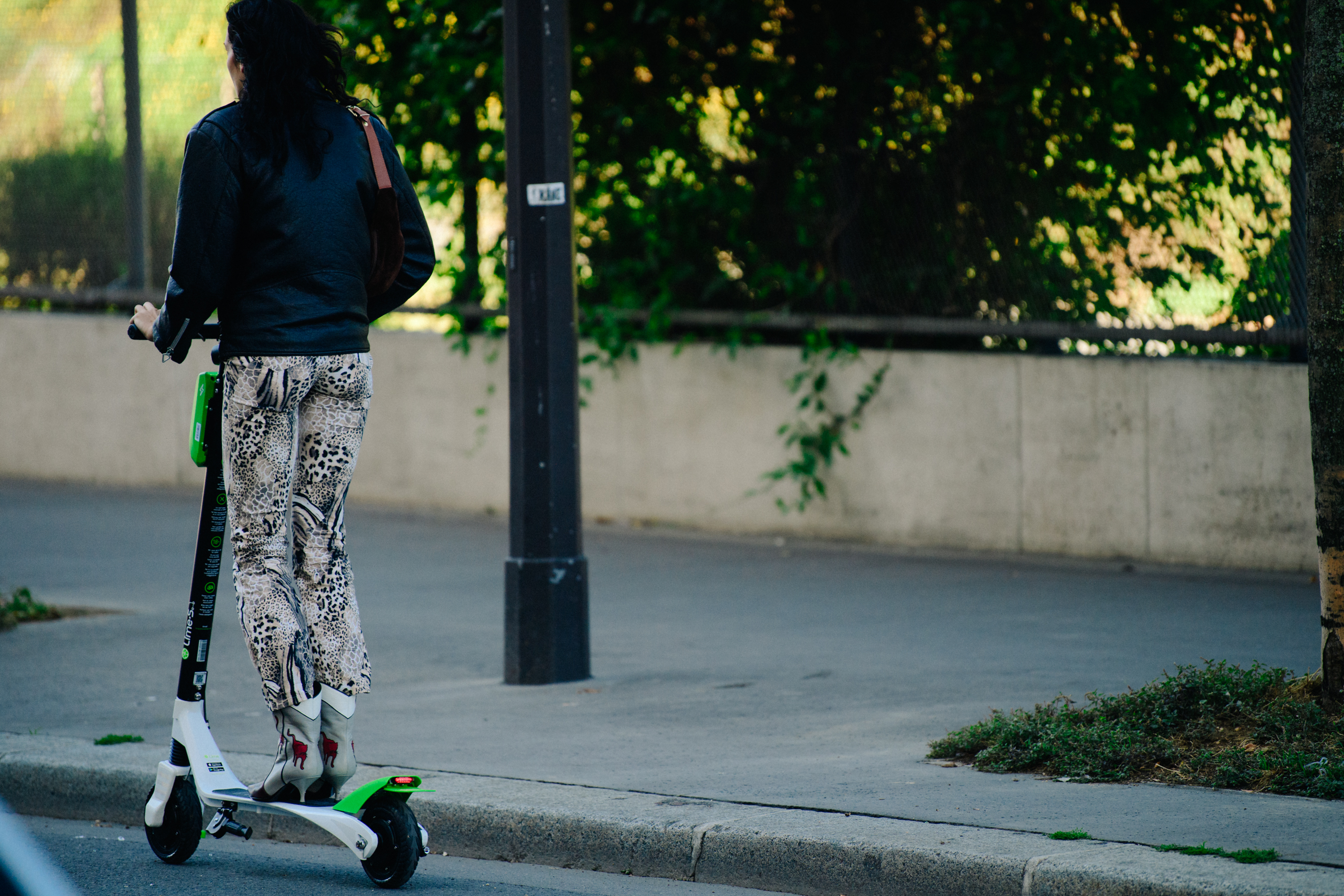 Woman riding electric scooter
