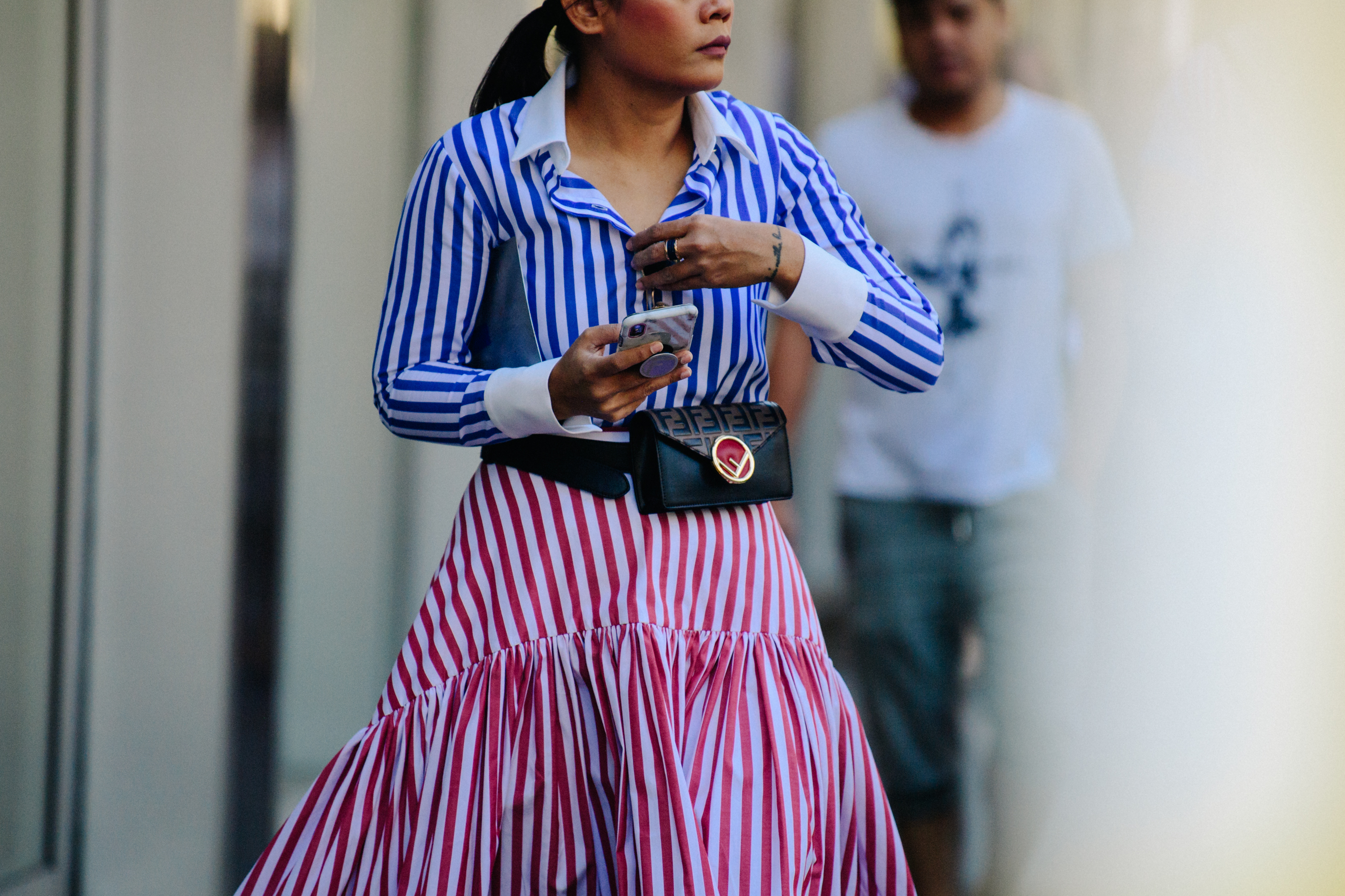 Woman wearing pink and blue striped dress