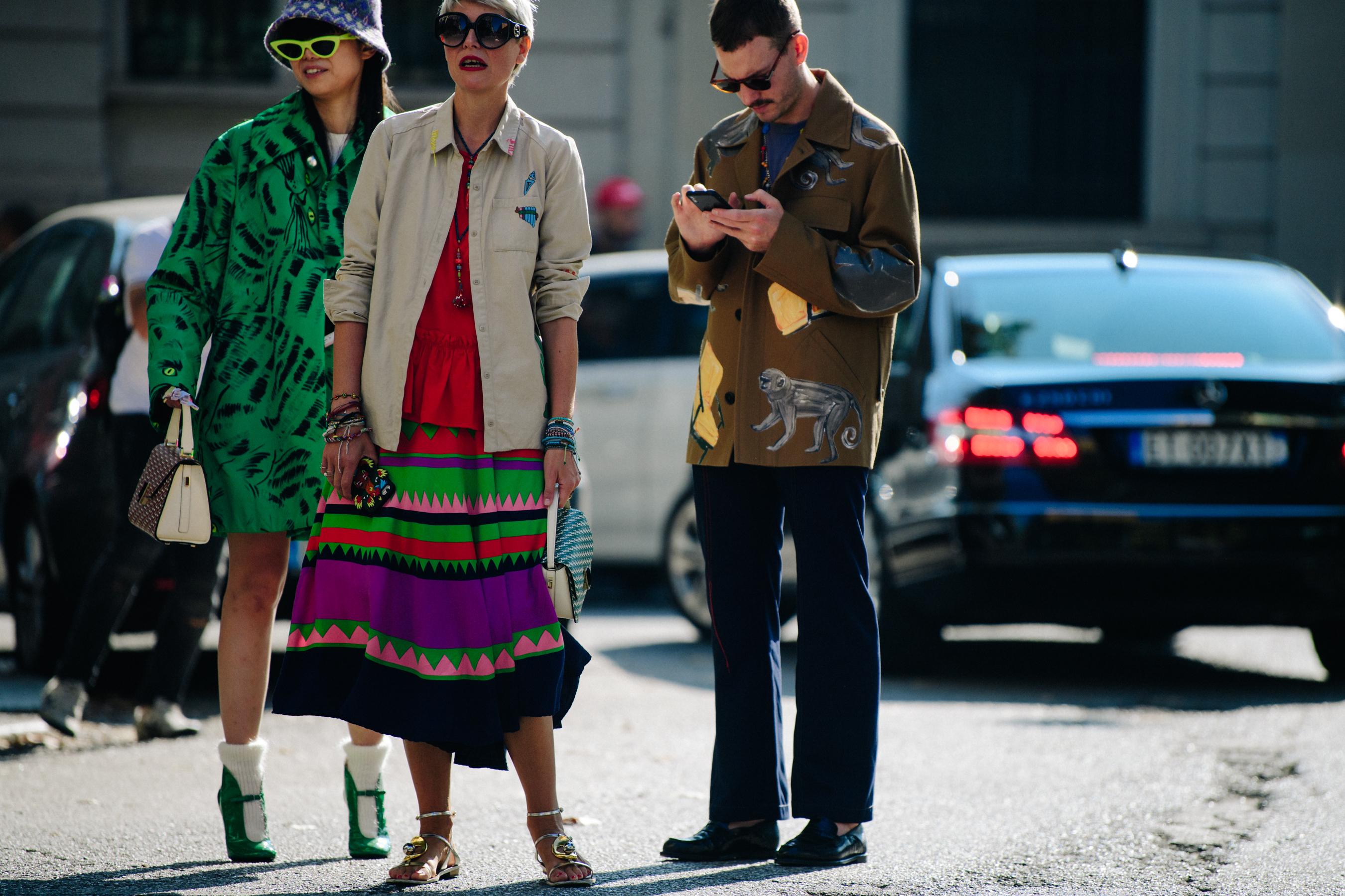 Three people wearing stylish jackets
