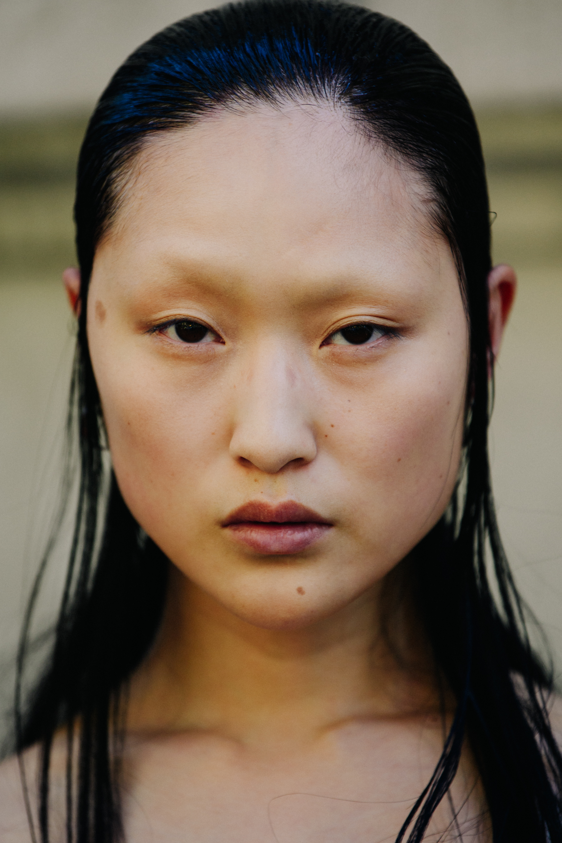 Portrait of model with slick black hair