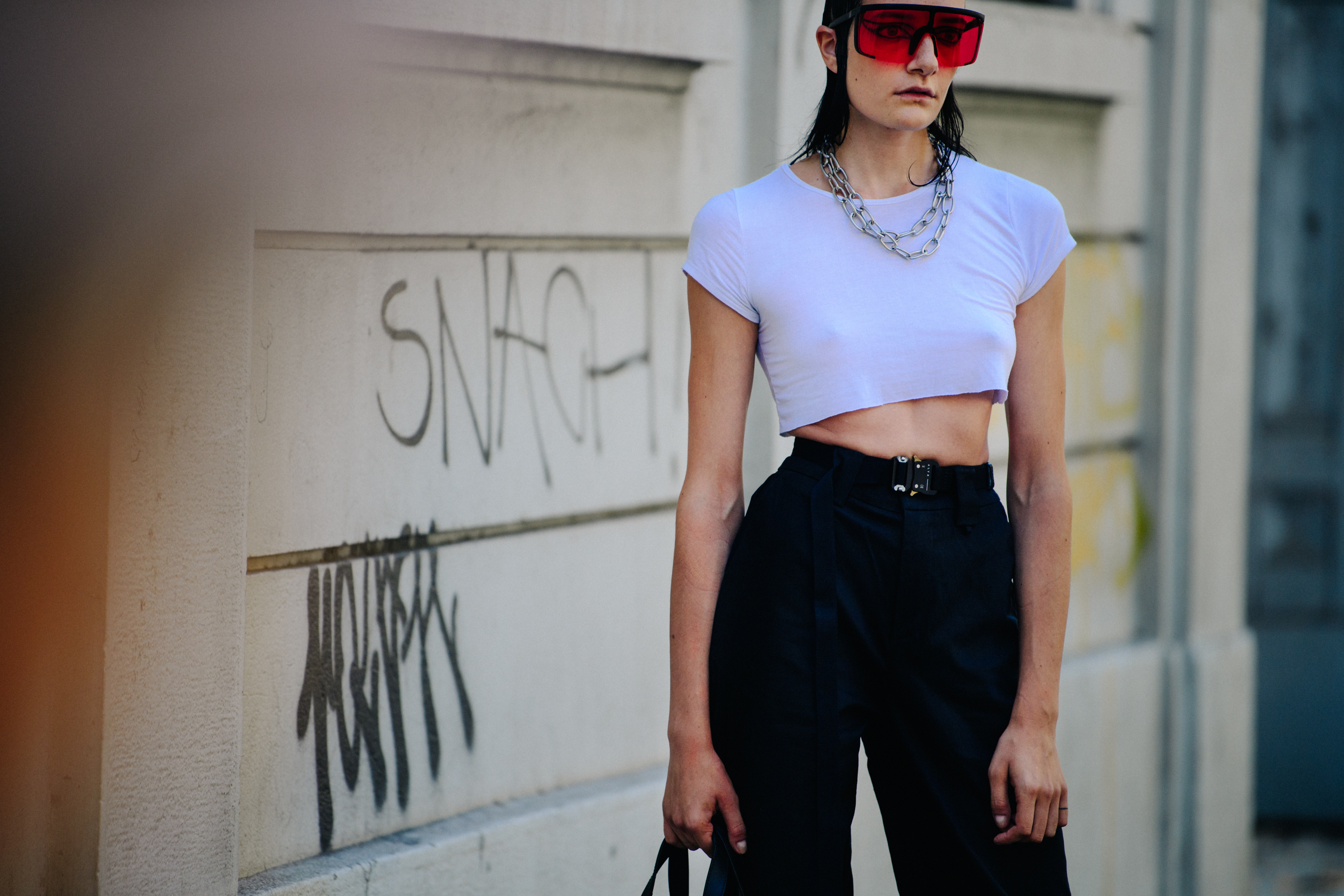 Model wearing large red glasses
