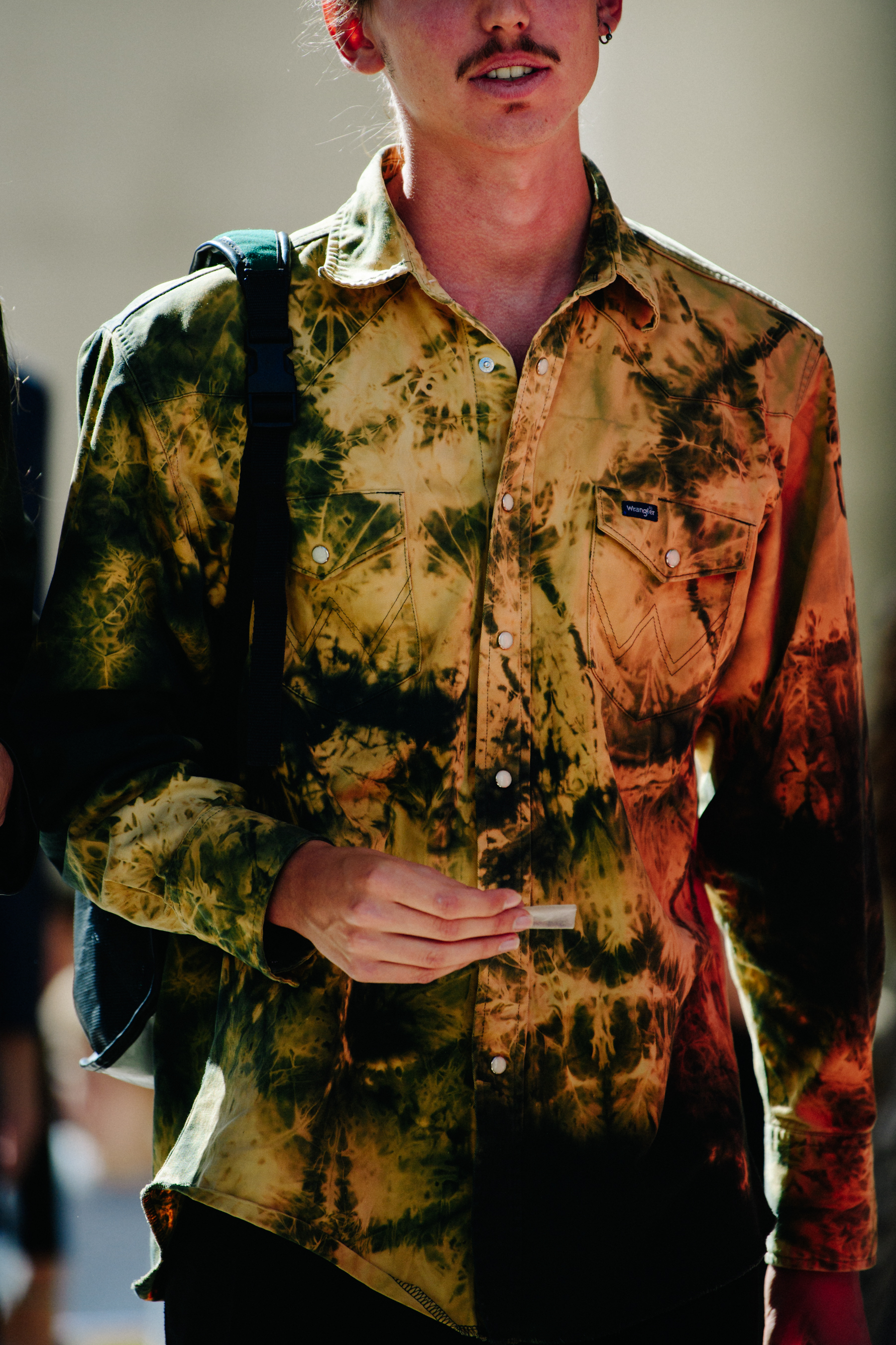 Man wearing brown Wrangler shirt
