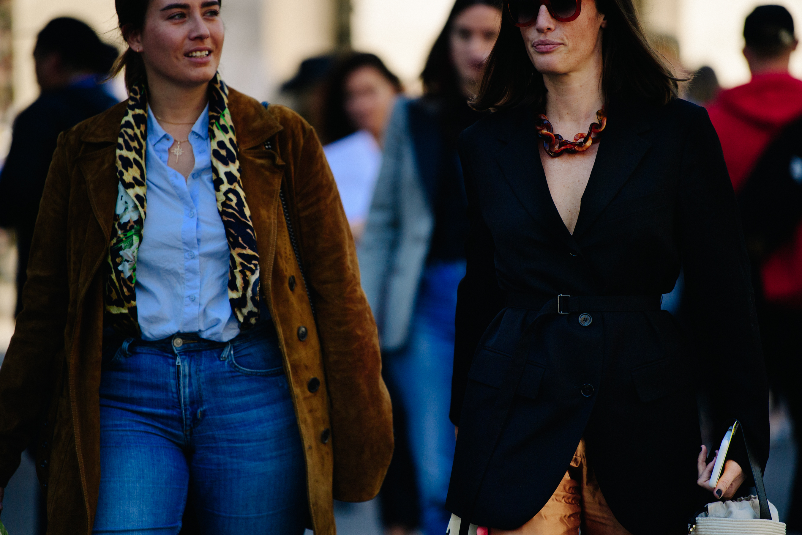 Two women wearing coats