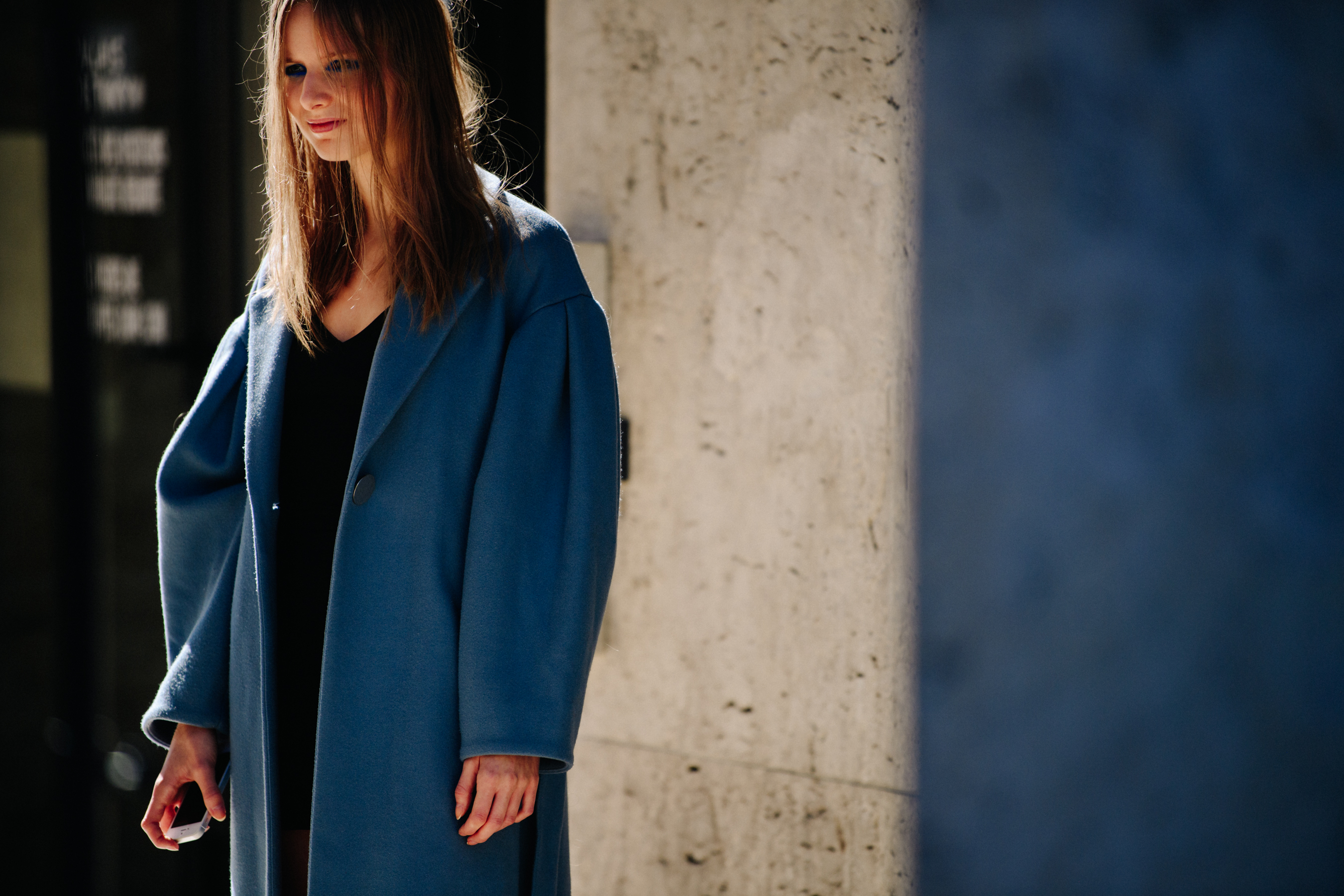 Woman wearing blue wool coat