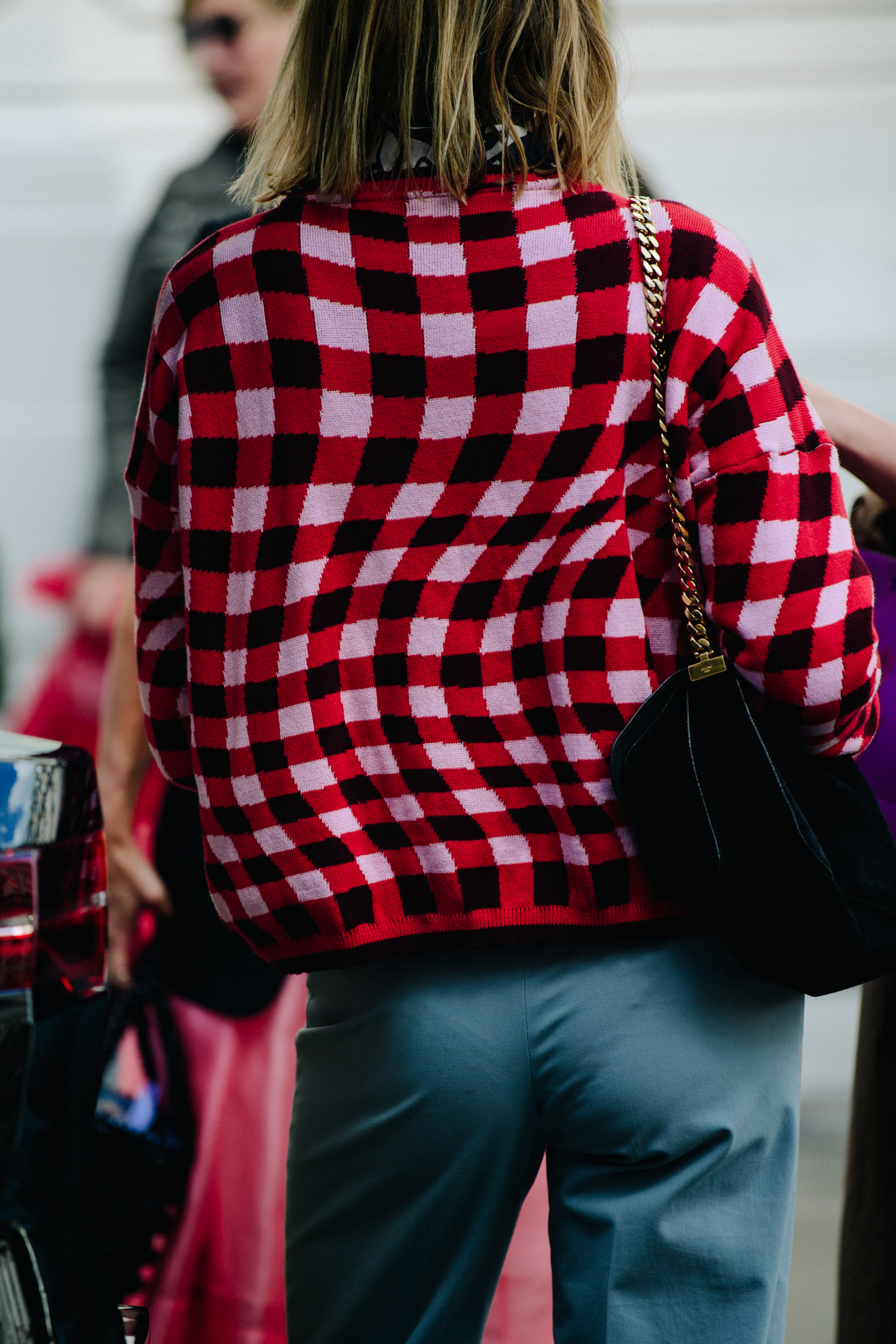 Woamn wearing red check jumper