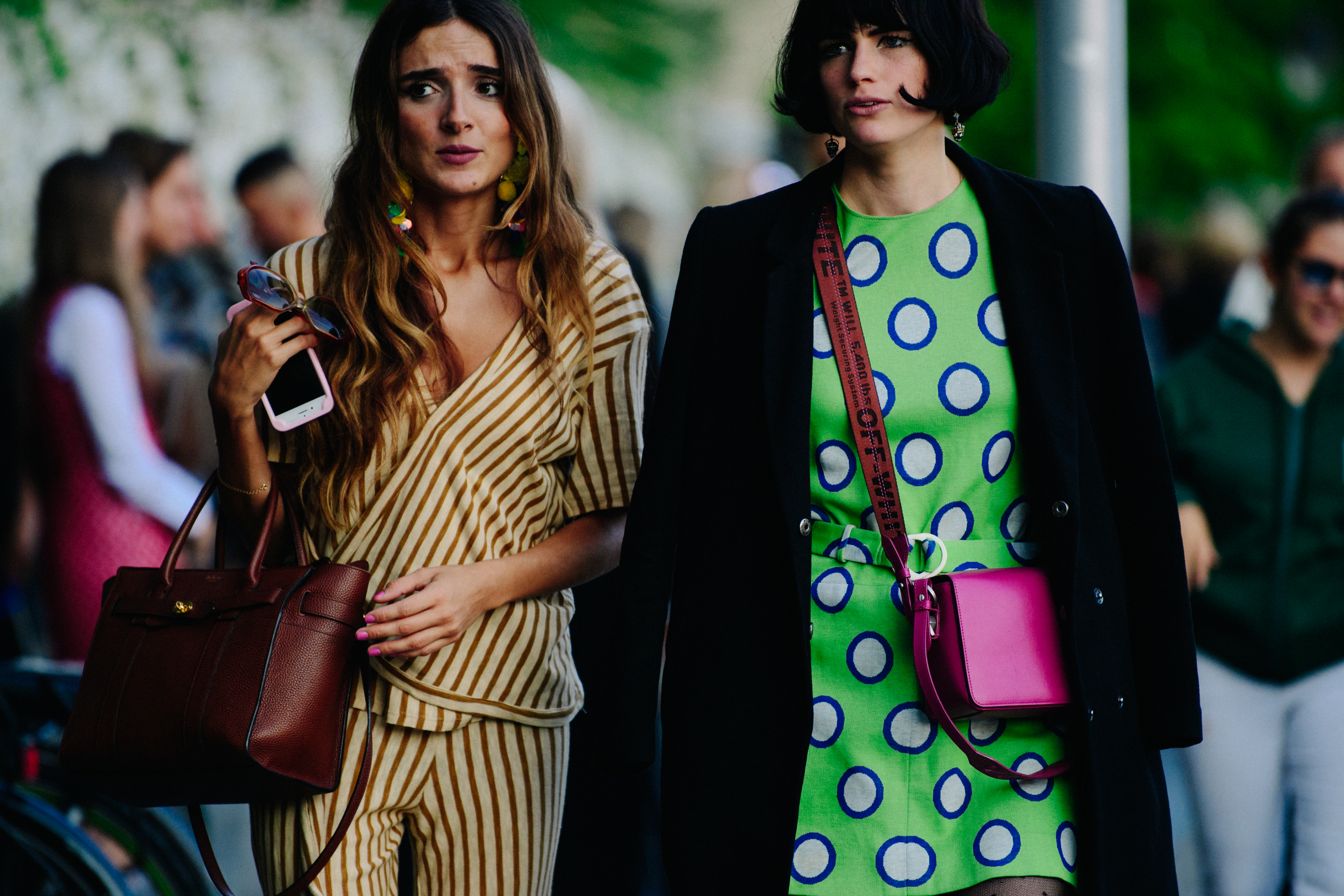 Two women wearing pattern tops
