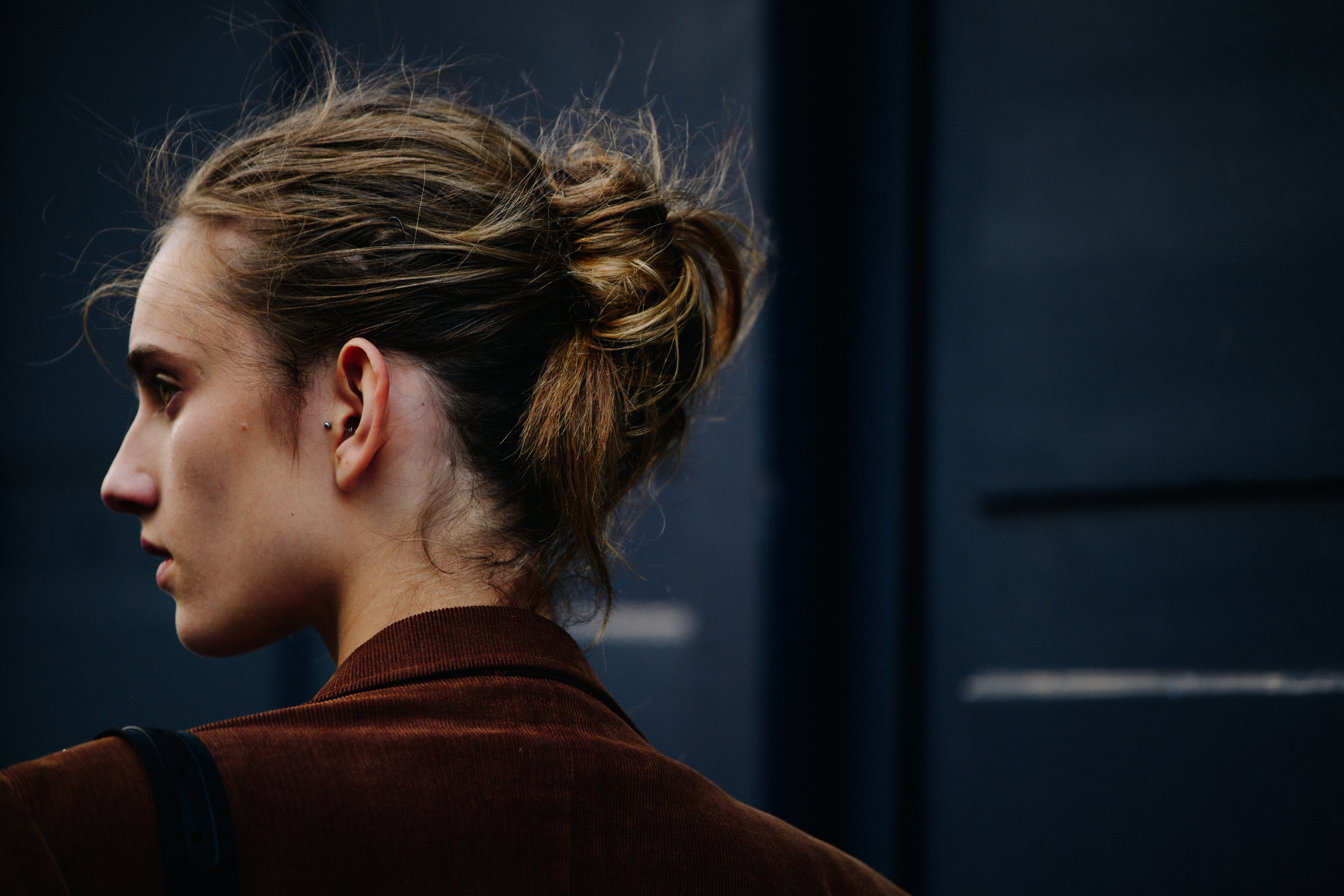 Model wearing brown jacket