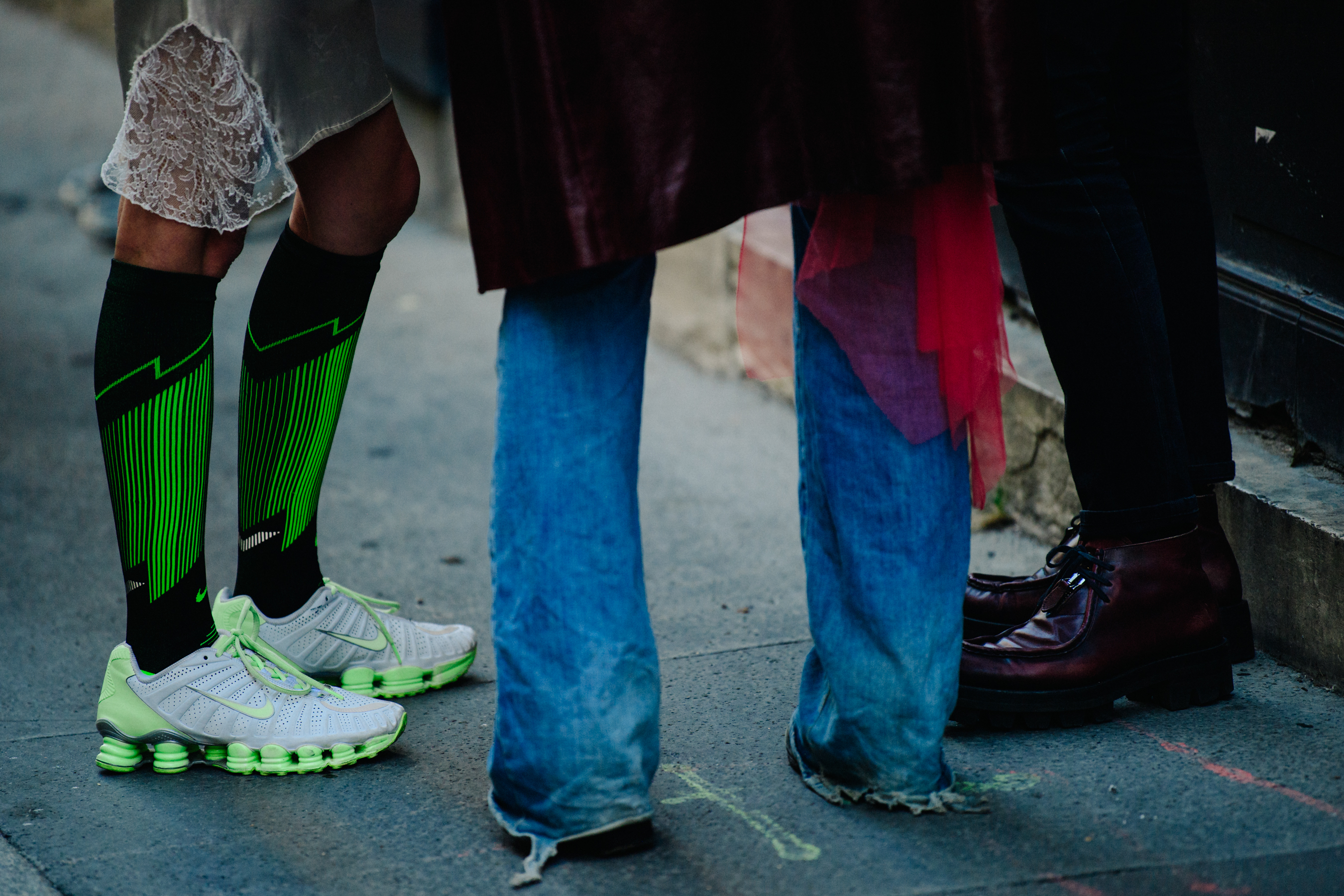 Girl wearing green Nike sneakers and socks