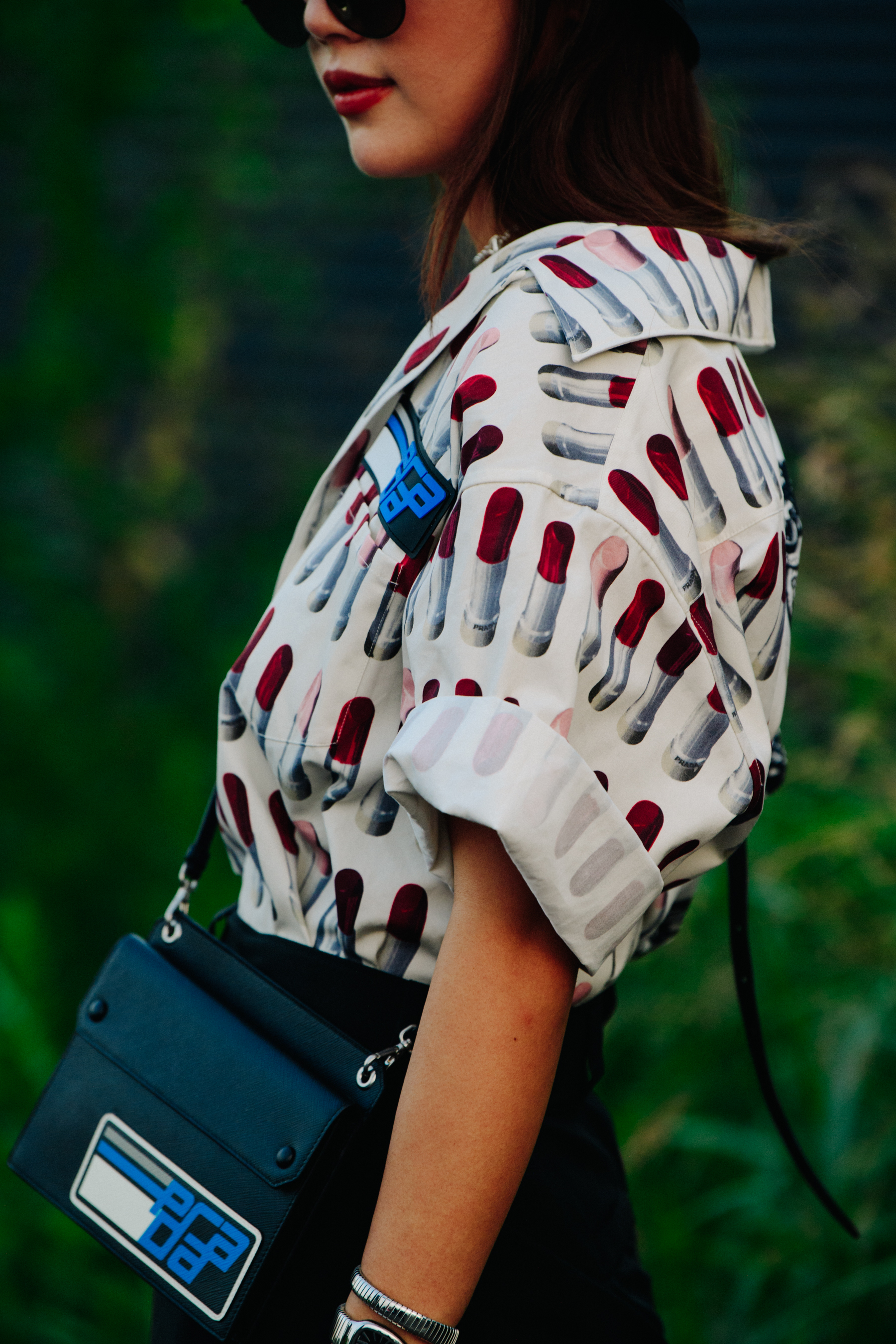 Woman wearing white Prada shirt