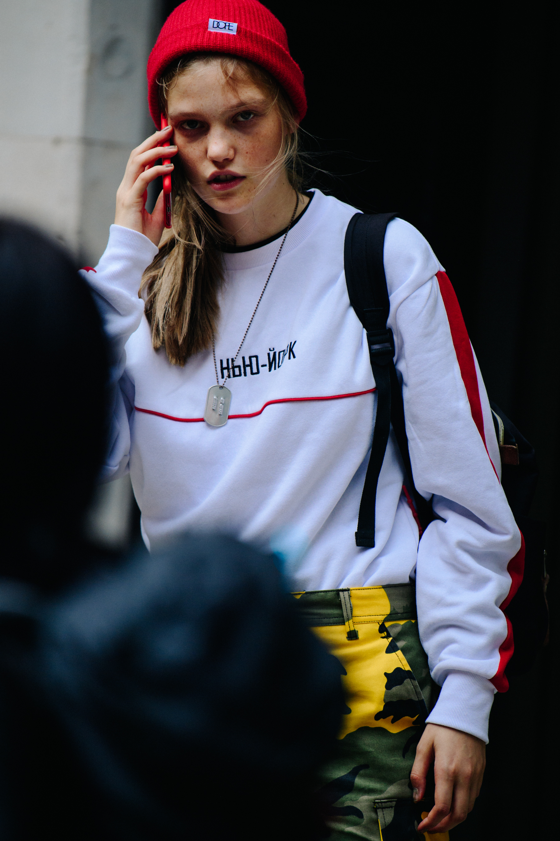 Model wearing red beanie