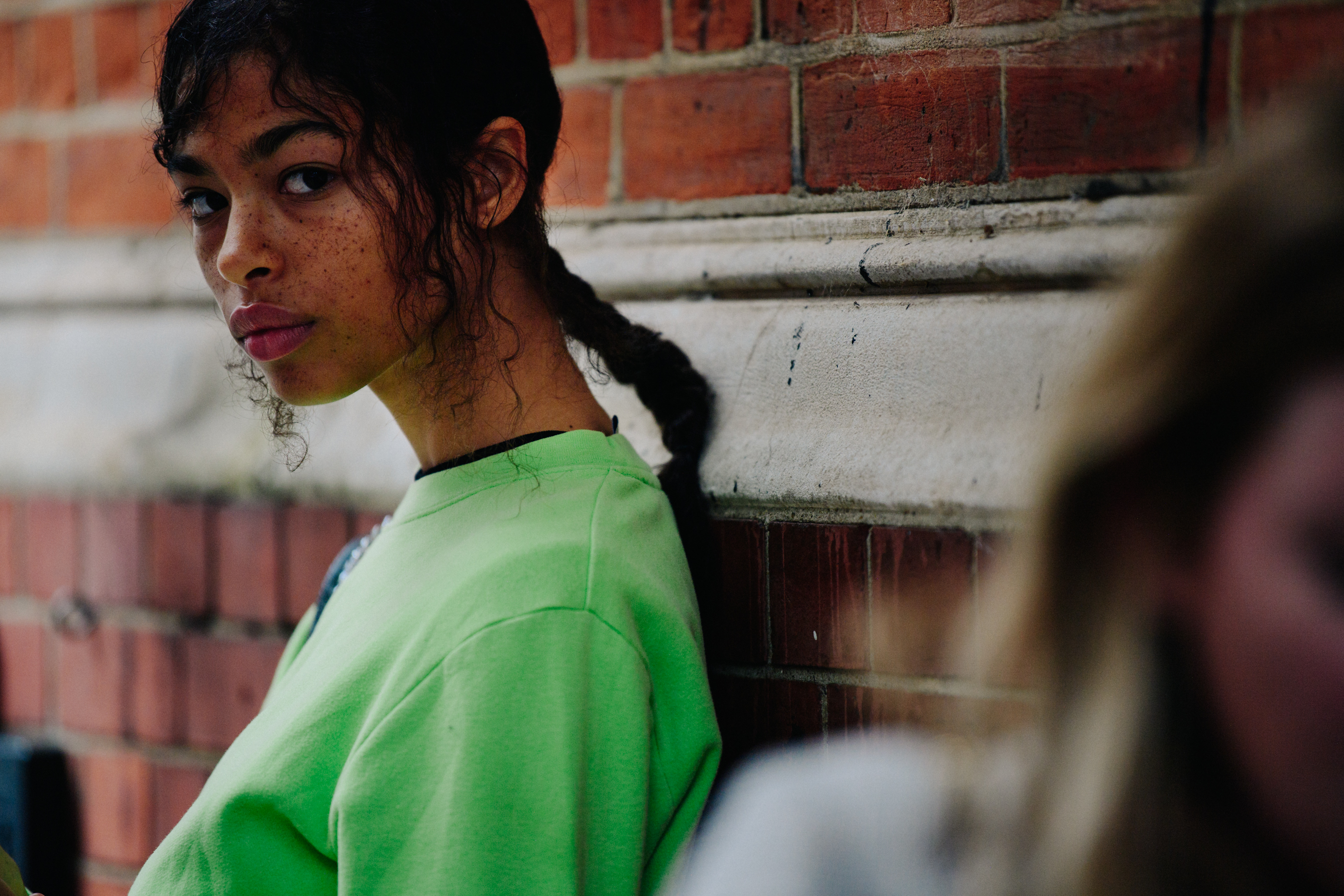 Model wearing green jumper