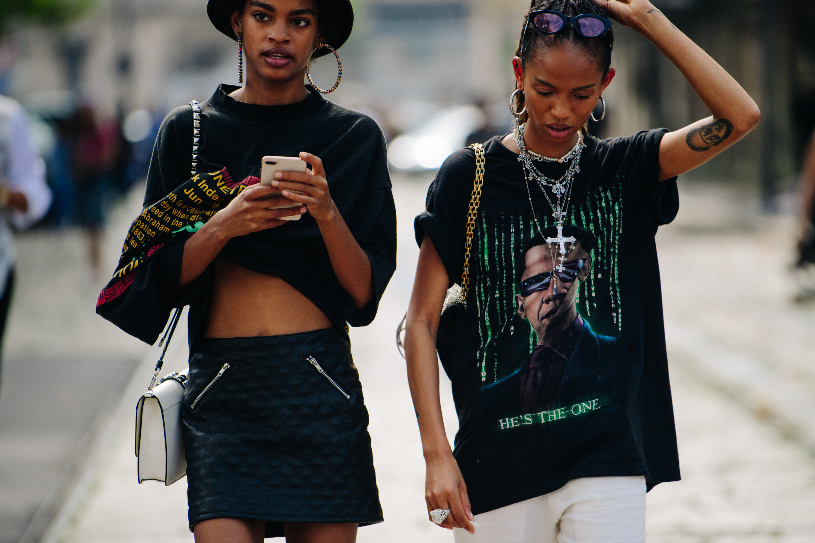 Two models wearing black tee shirts