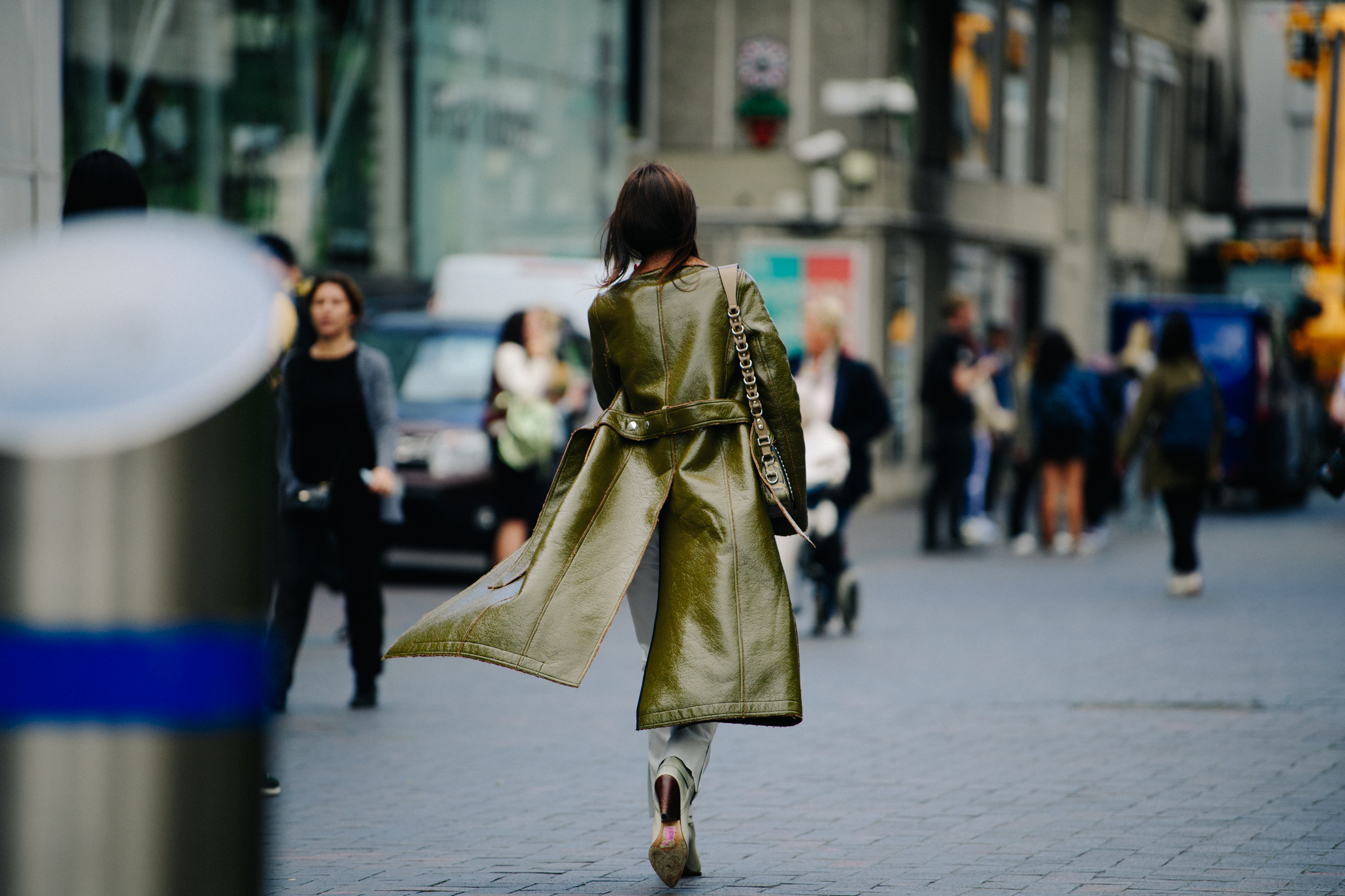 Woman wearing long green coat