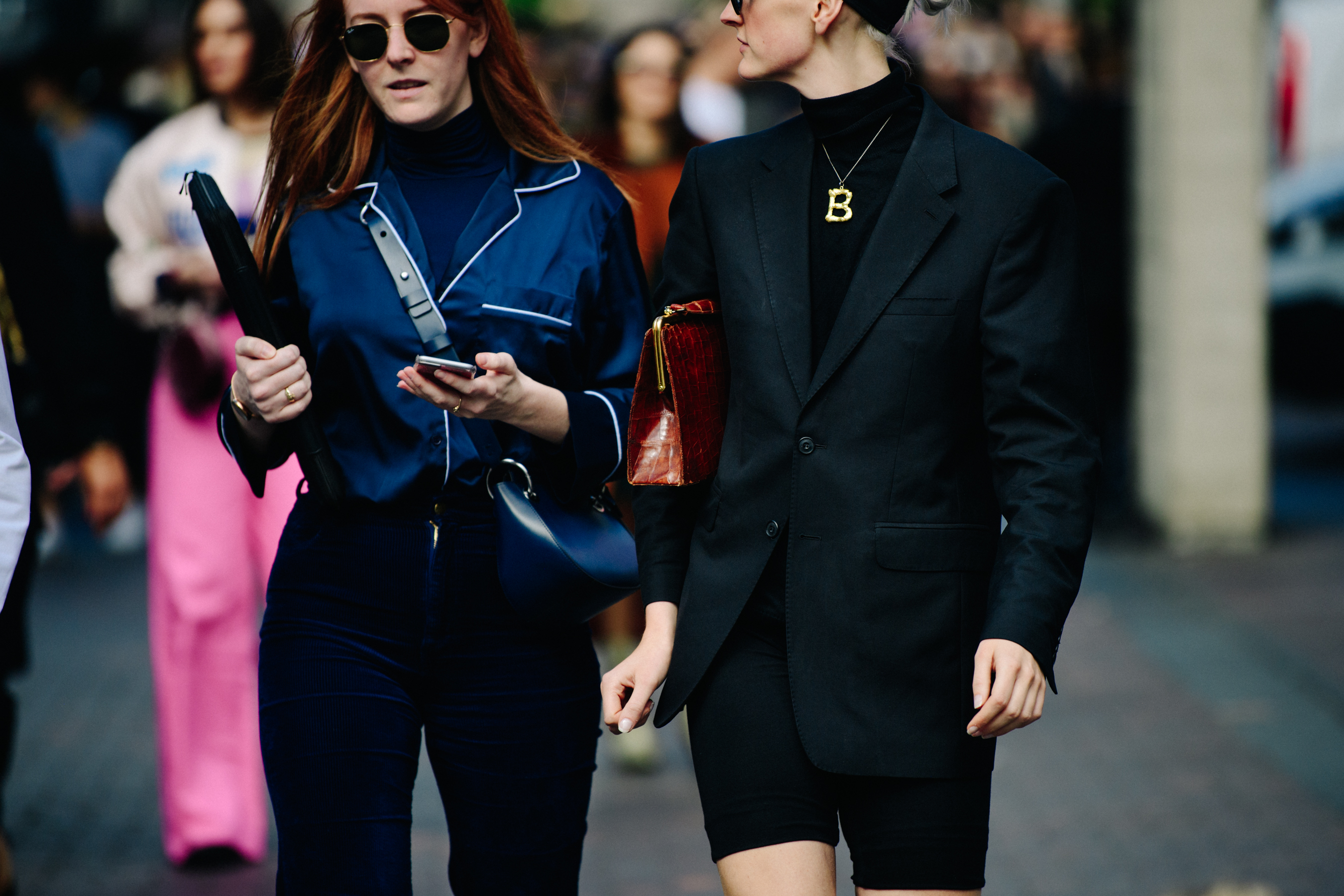 Two women wearing dark shirts