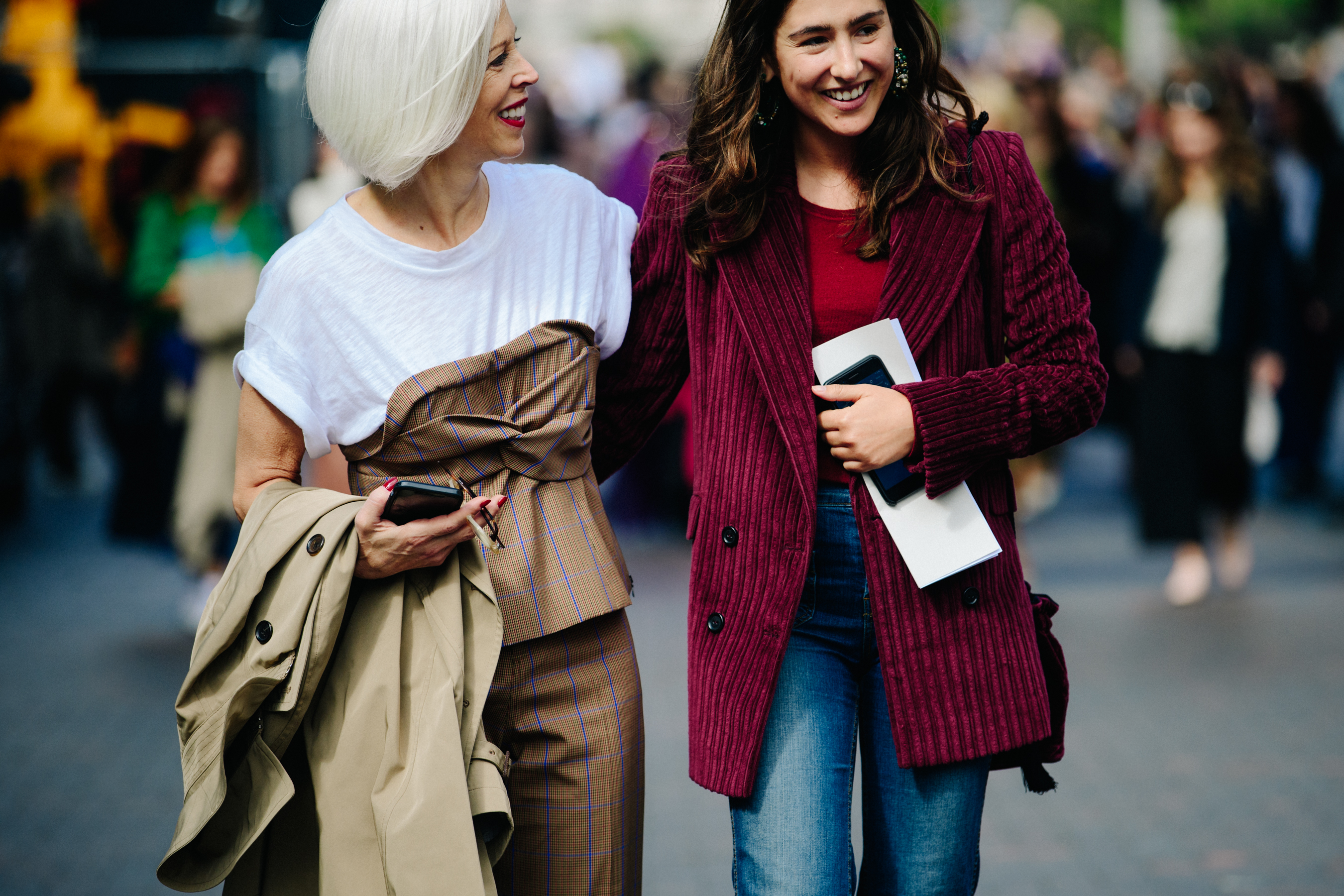 Two women wearing smart jackets