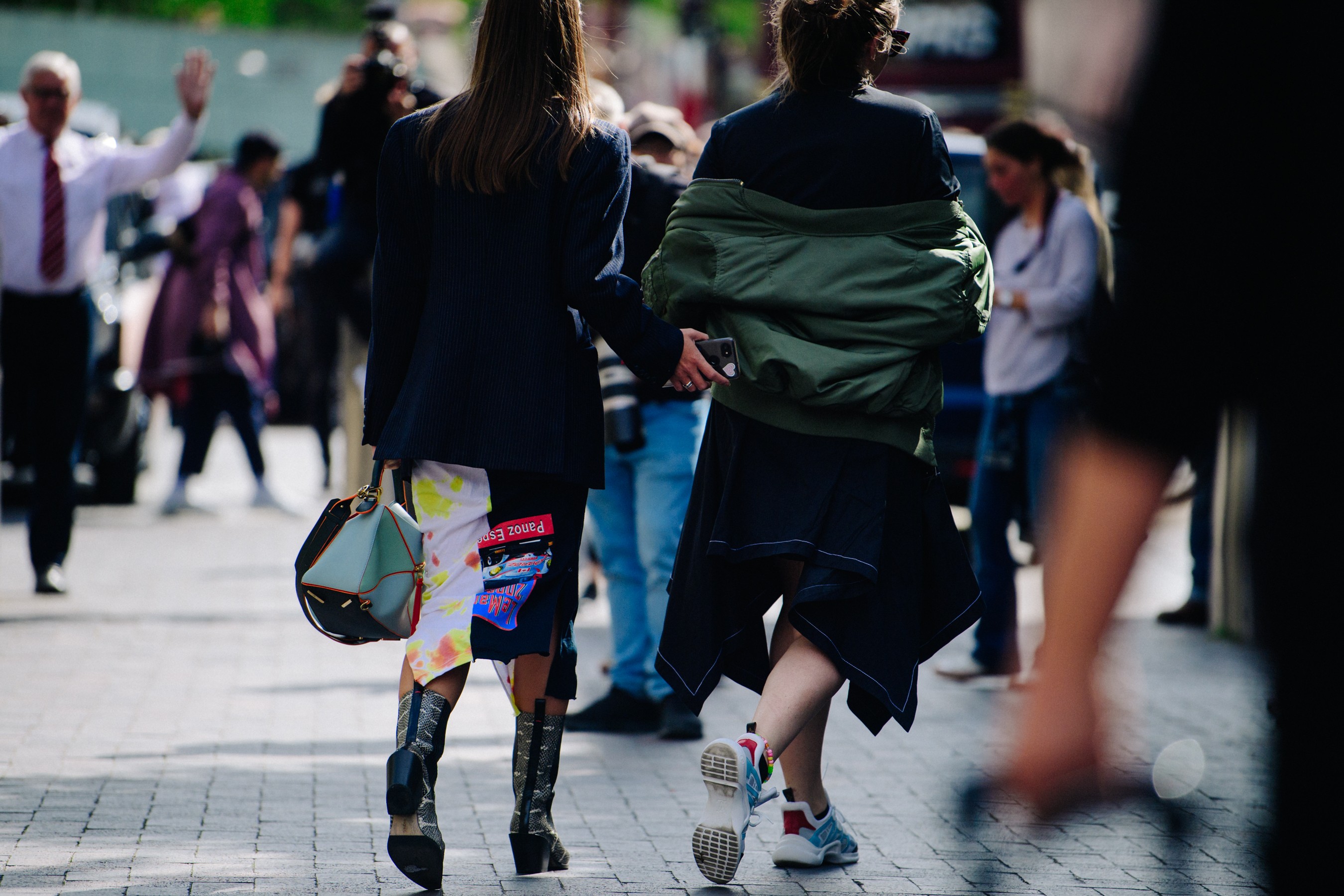Two women wearing stylish outfits