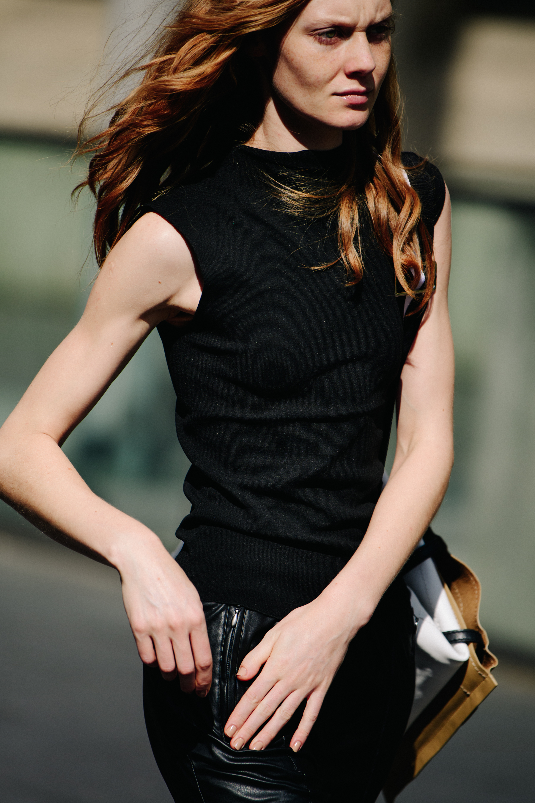 Woman wearing black vest and pants