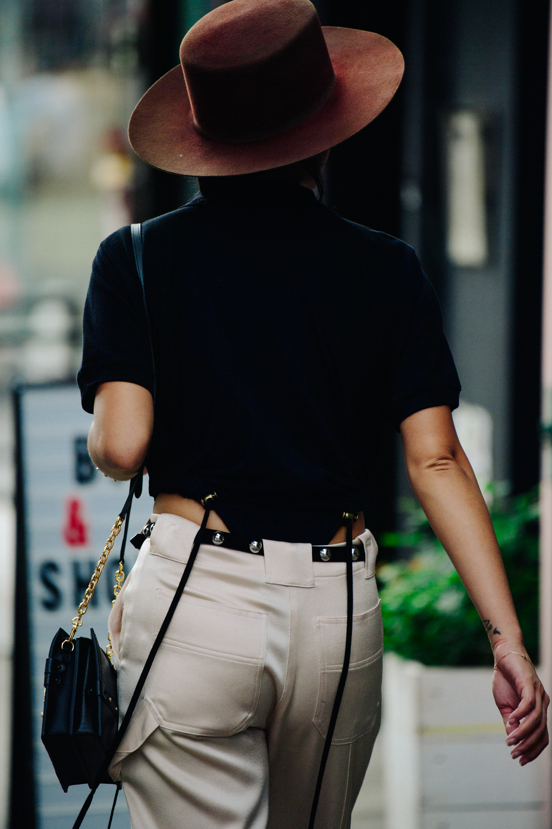 Woman wearing brown cowboy hat
