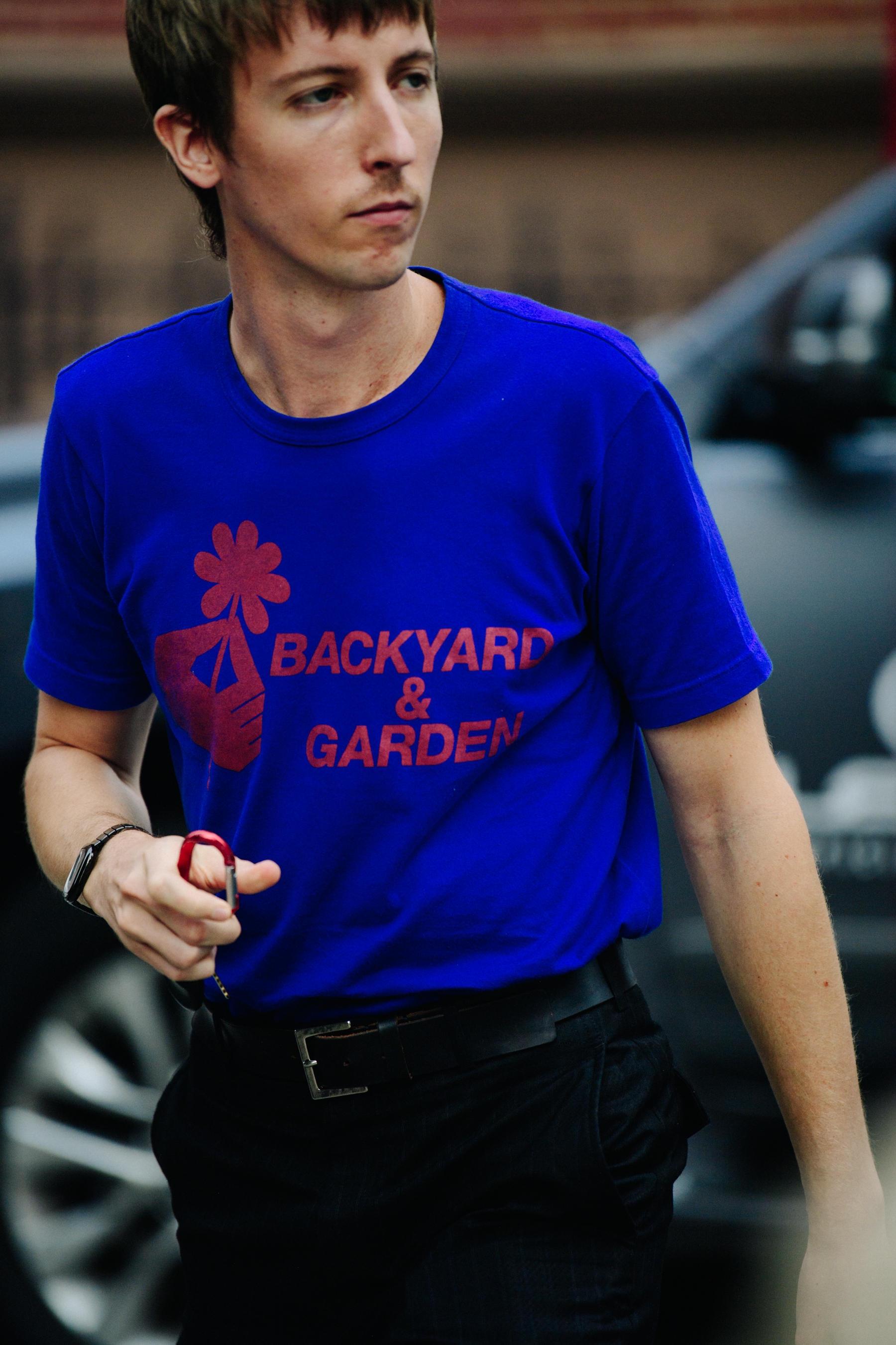 Man wearing blue tee shirt