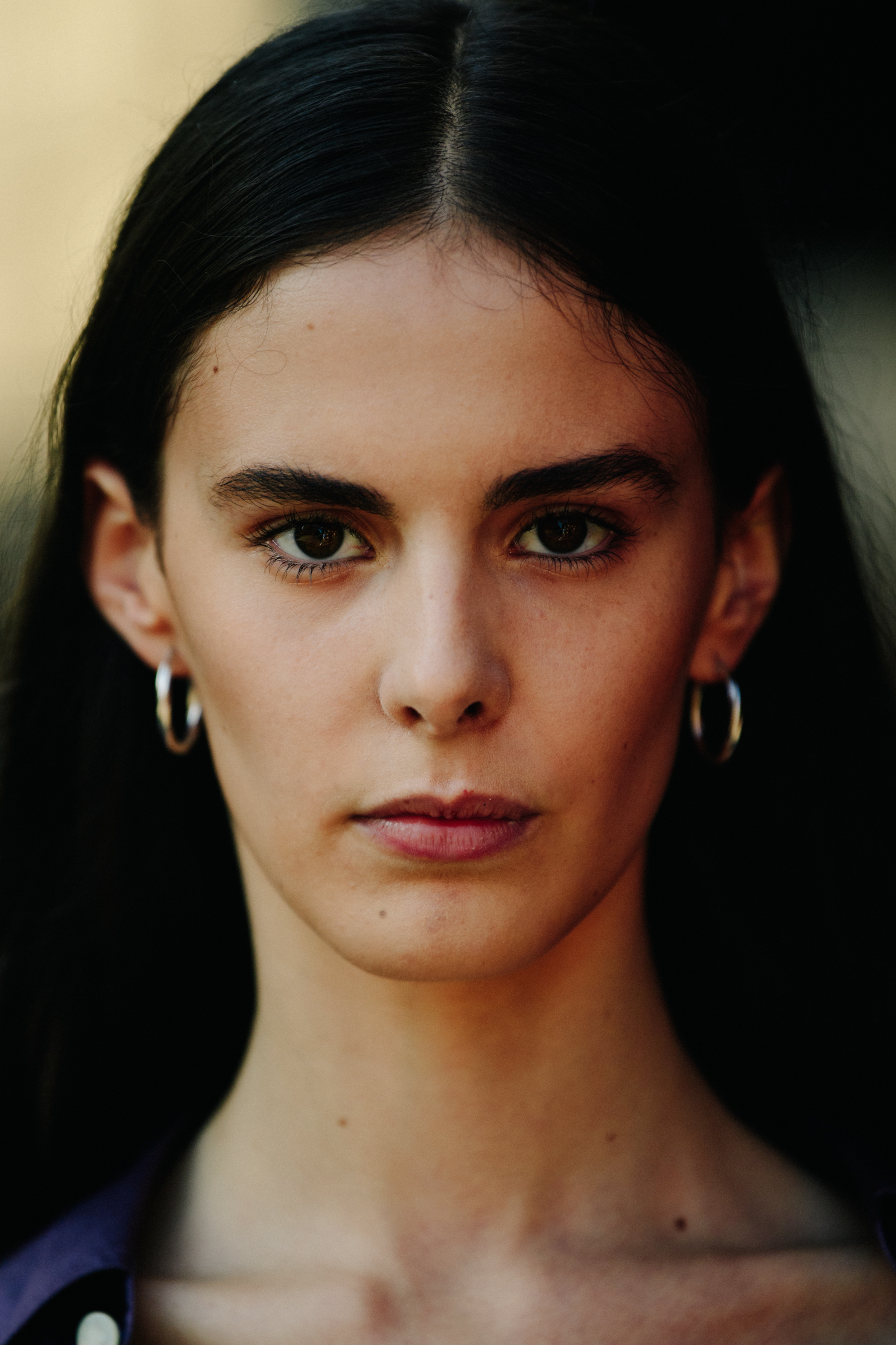 Portrait of model wearing hoop earrings