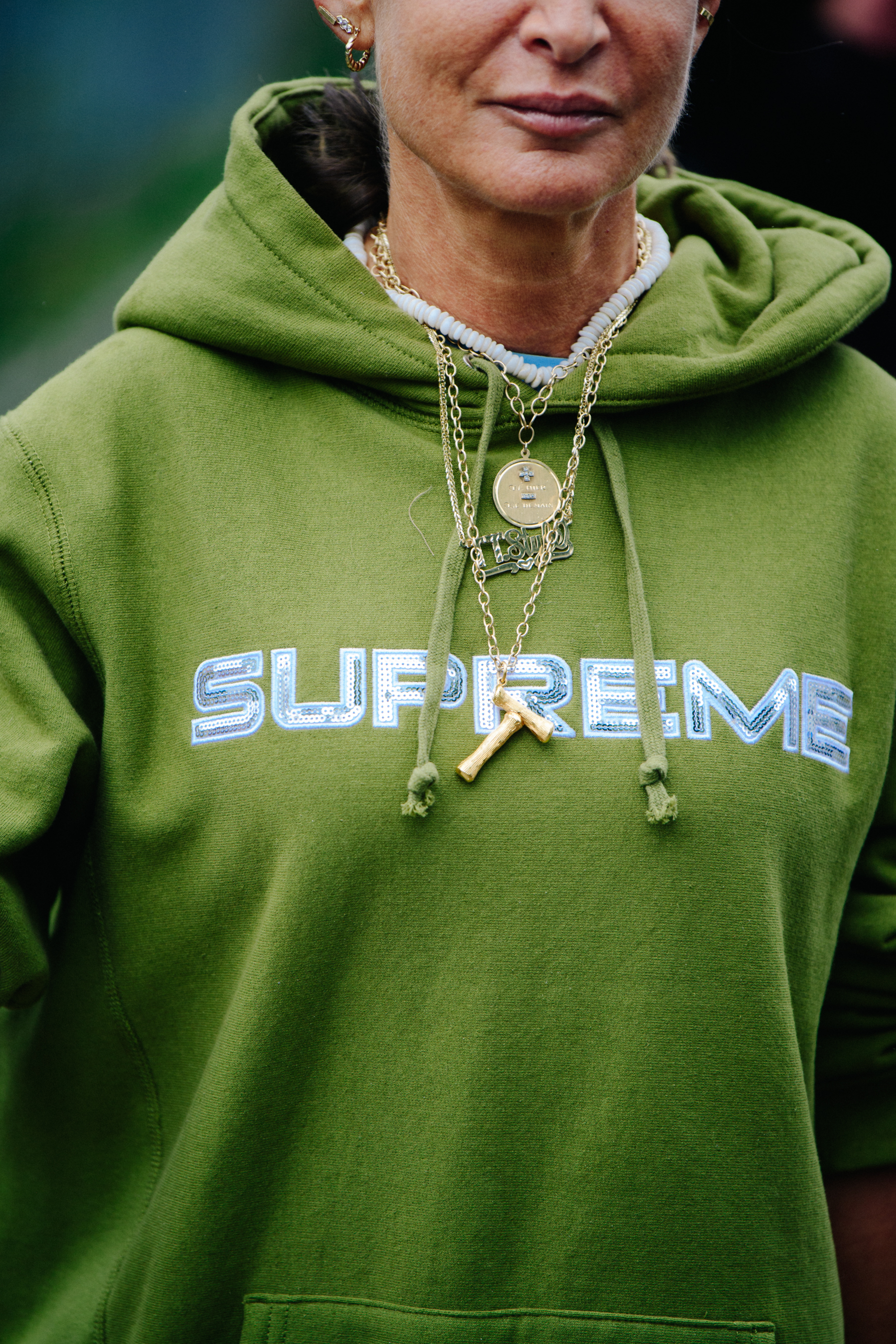 Woman wearing green hoodie