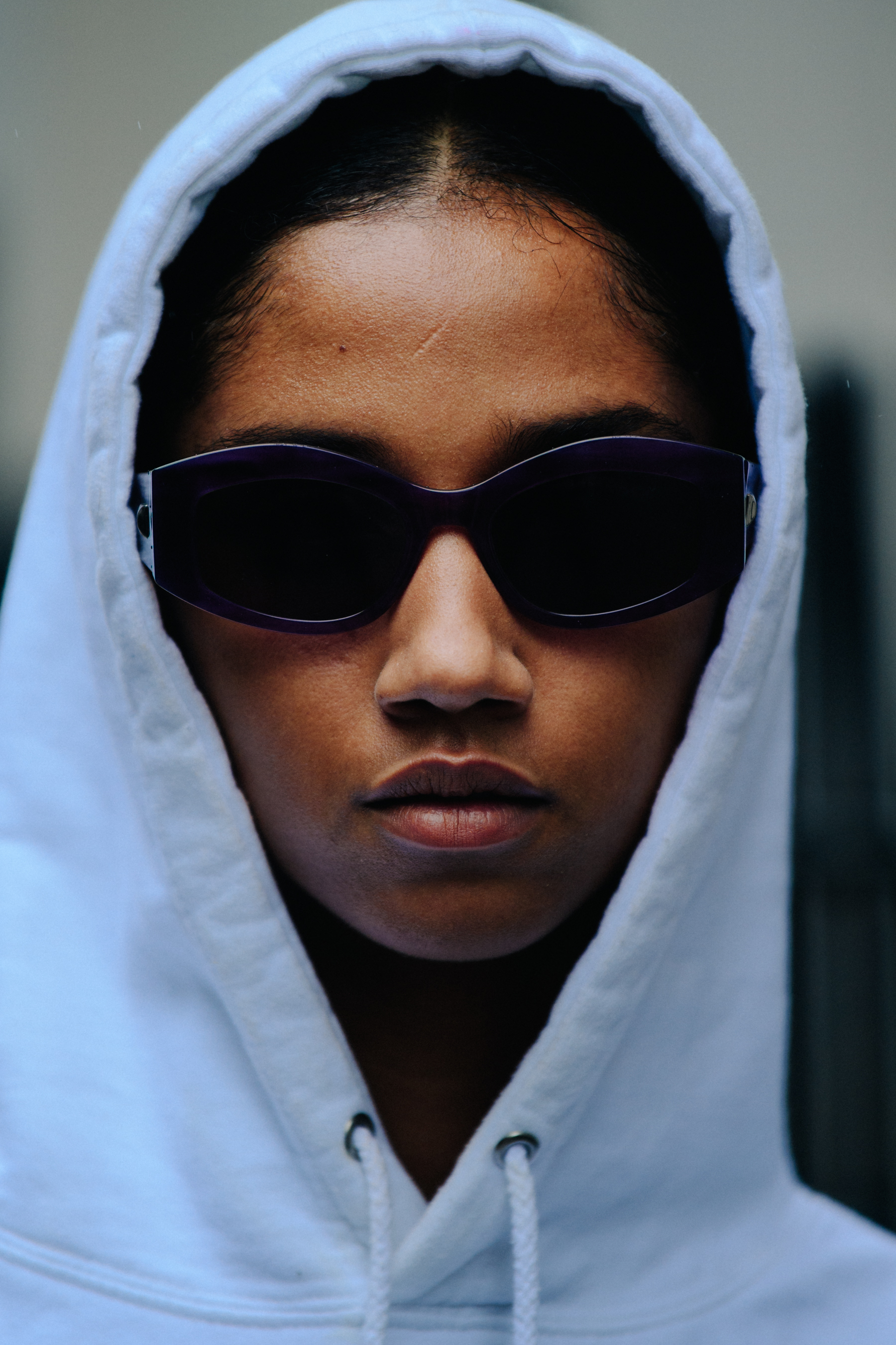 Portrait of model wearing white hoodie