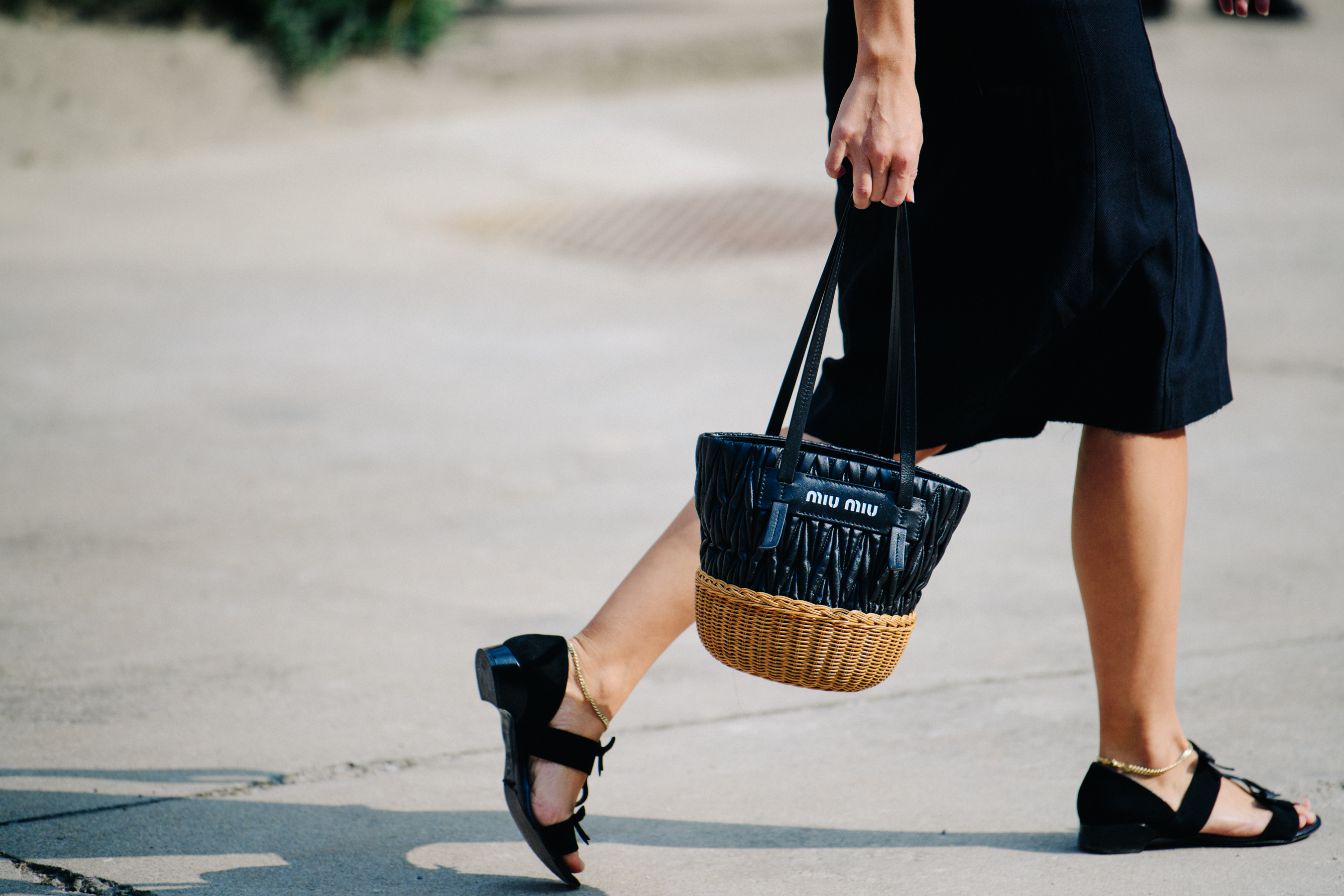 Woman carrying Miu Miu bag