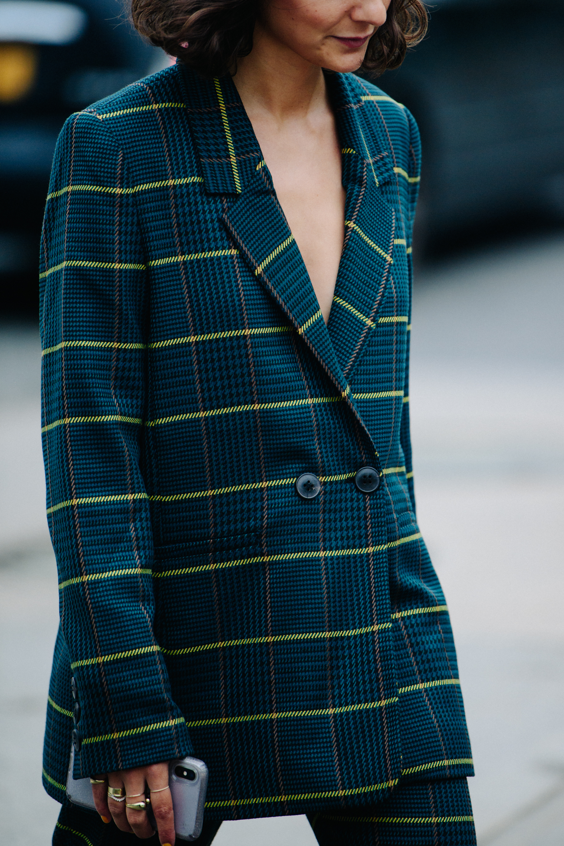 Woman wearing blue check jacket