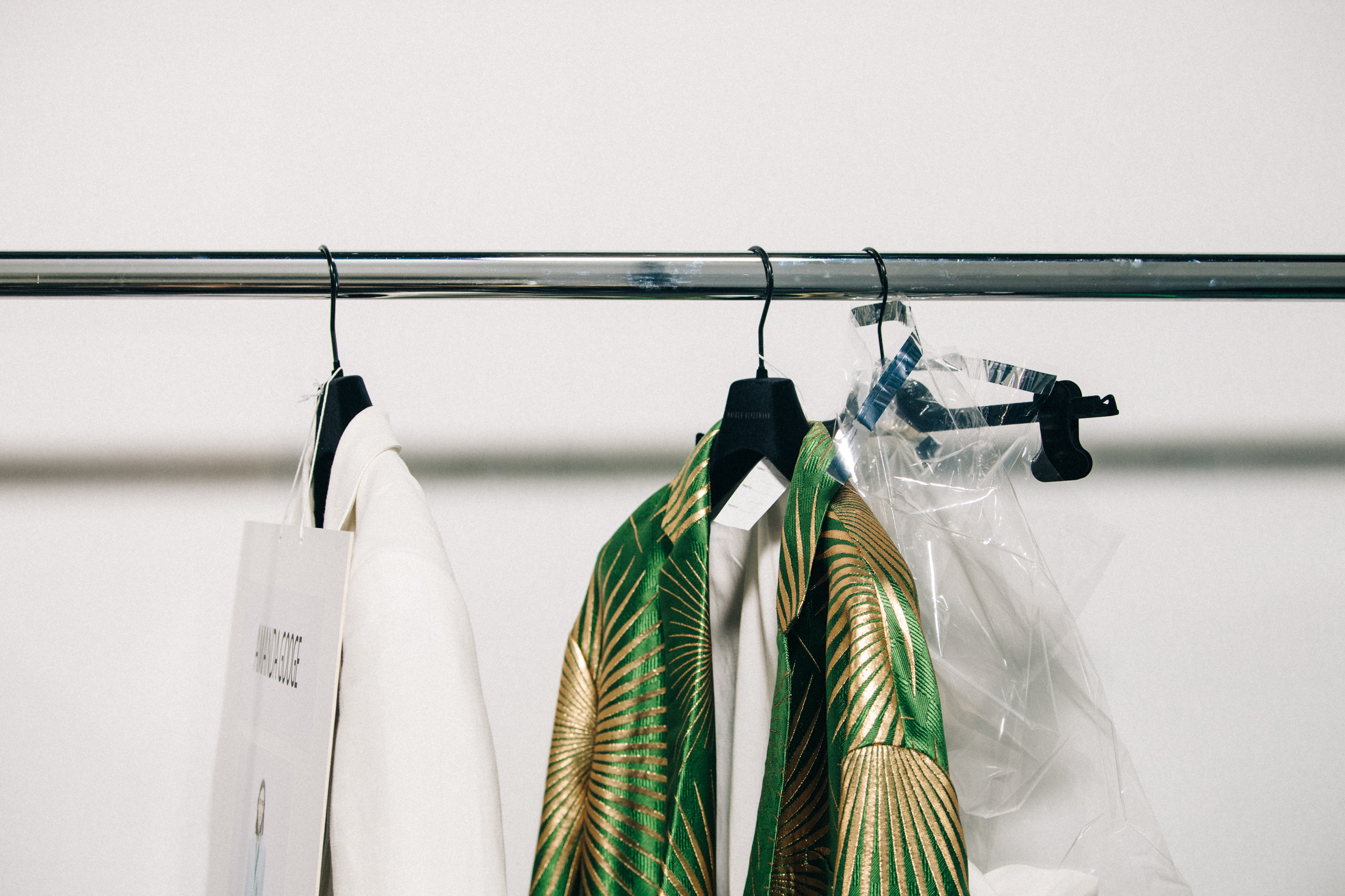Clothes hanging backstage at Haider Ackermann