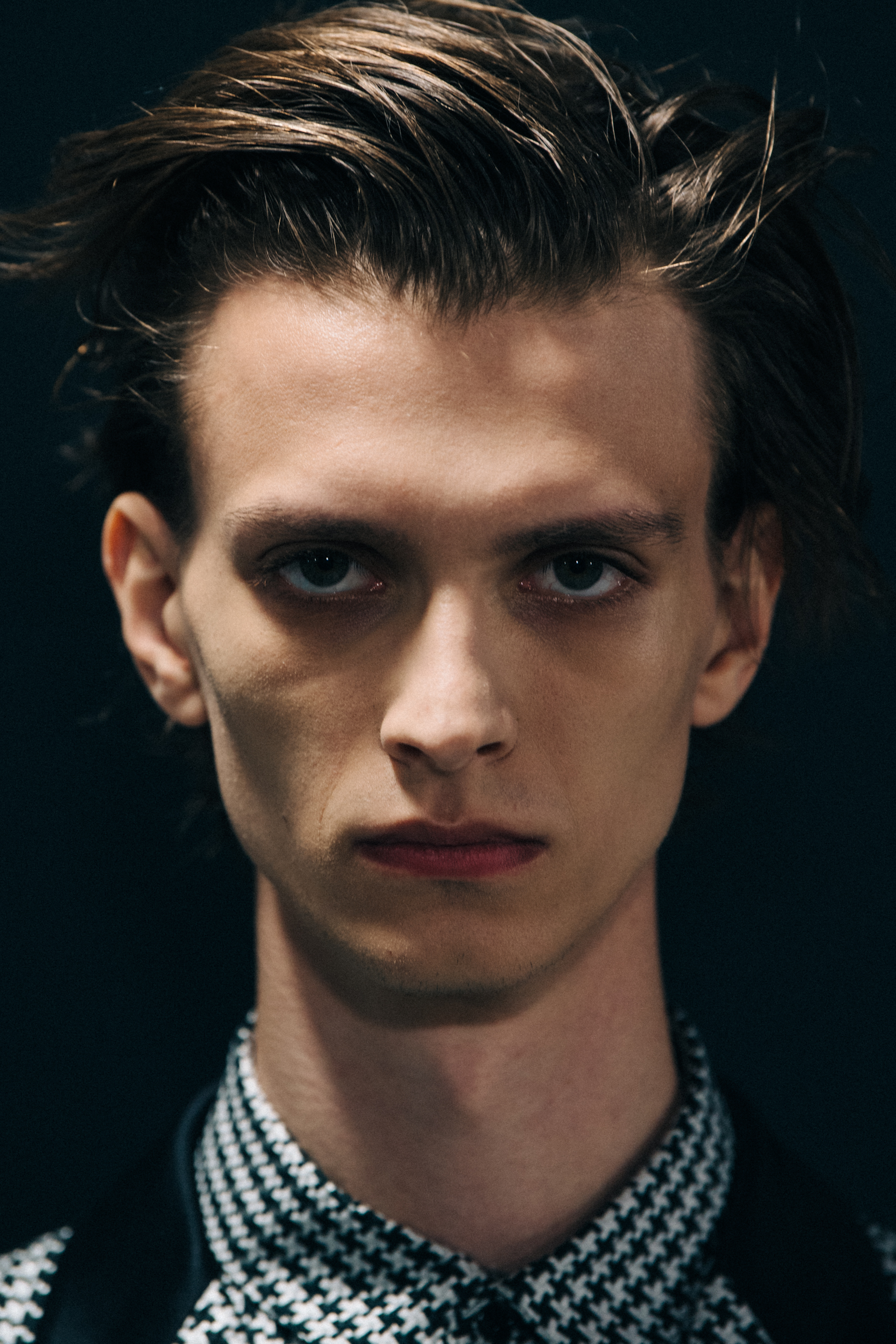 Portrait of model with slicked back hair