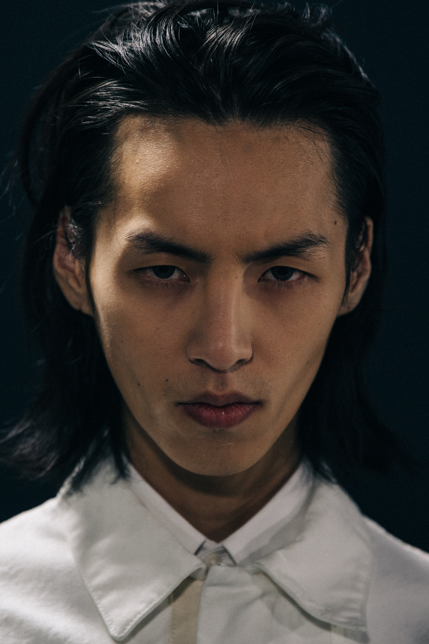 Portrait of model with slicked back hair