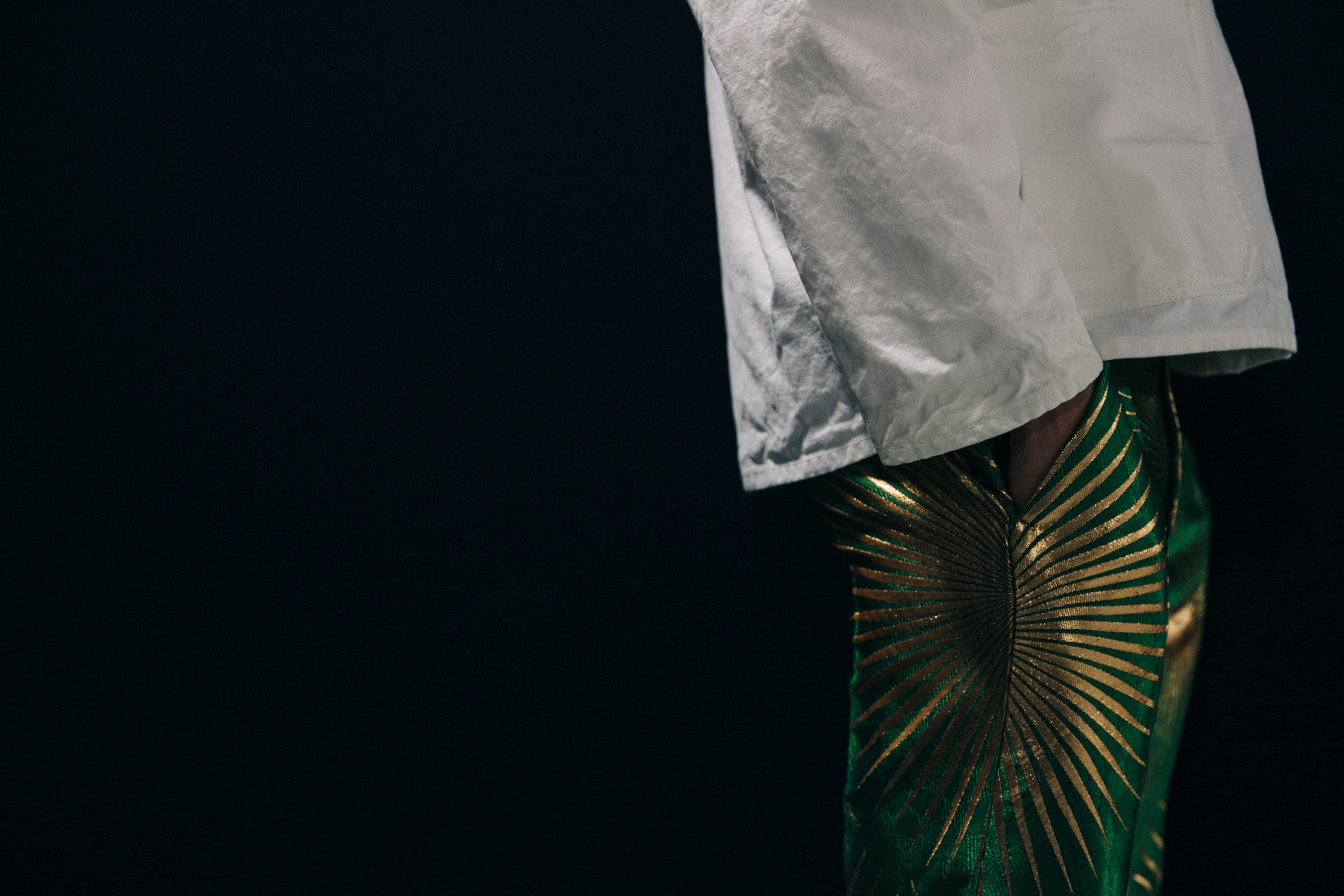 Model wearing green trousers at Haider Ackermann