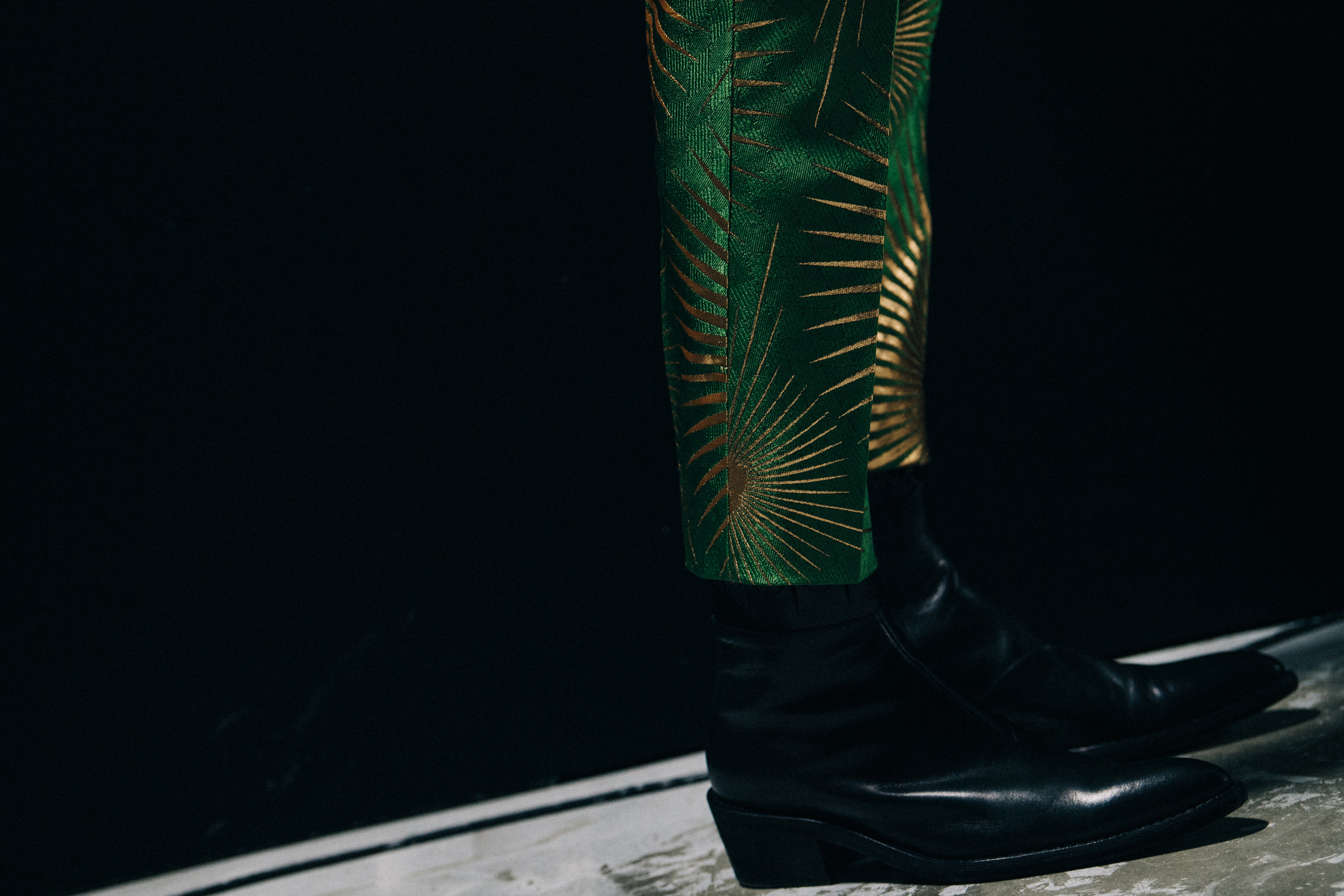 Model wearing green trousers at Haider Ackermann