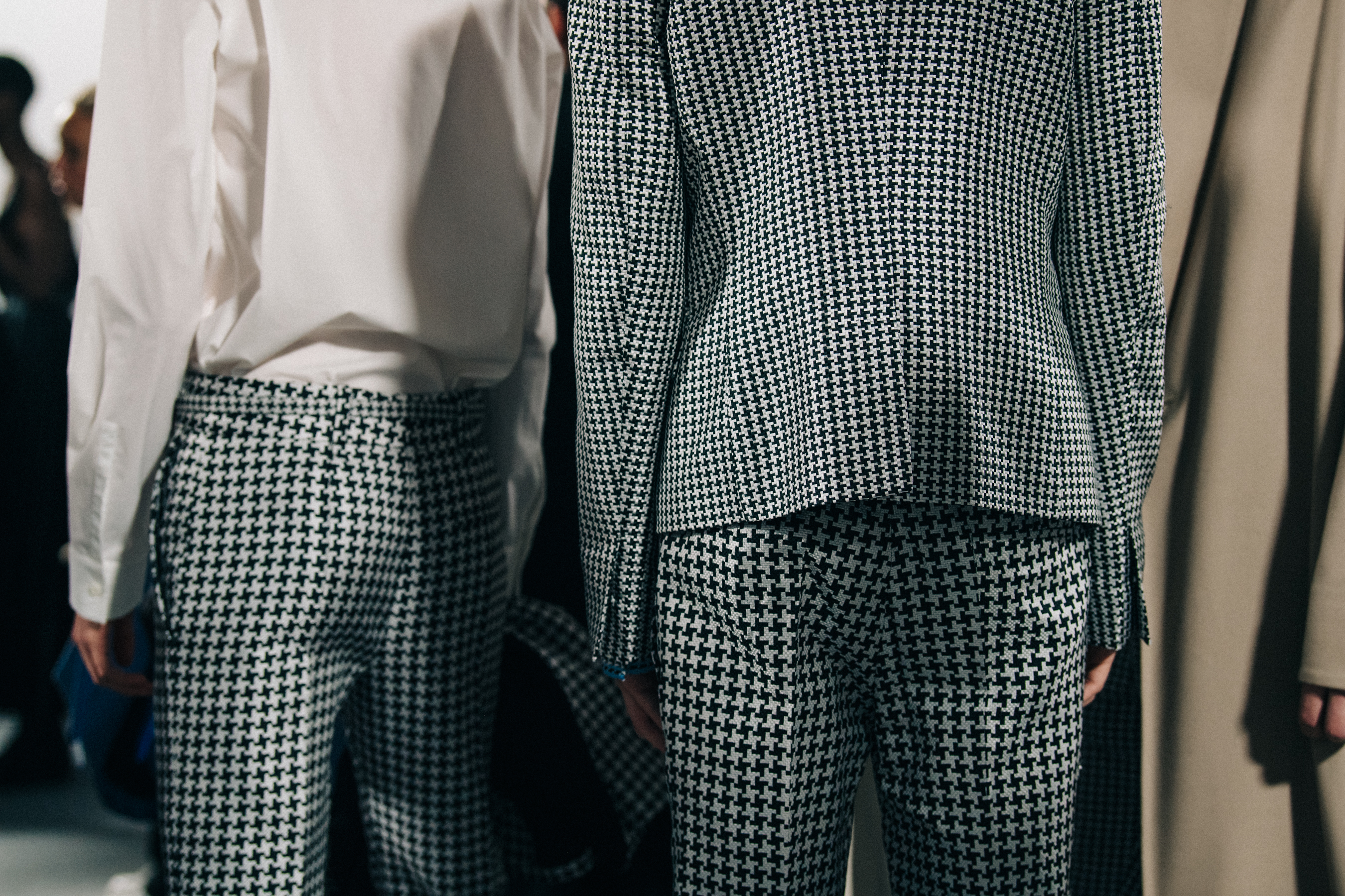 Models wearing white and tan at Haider Ackermann