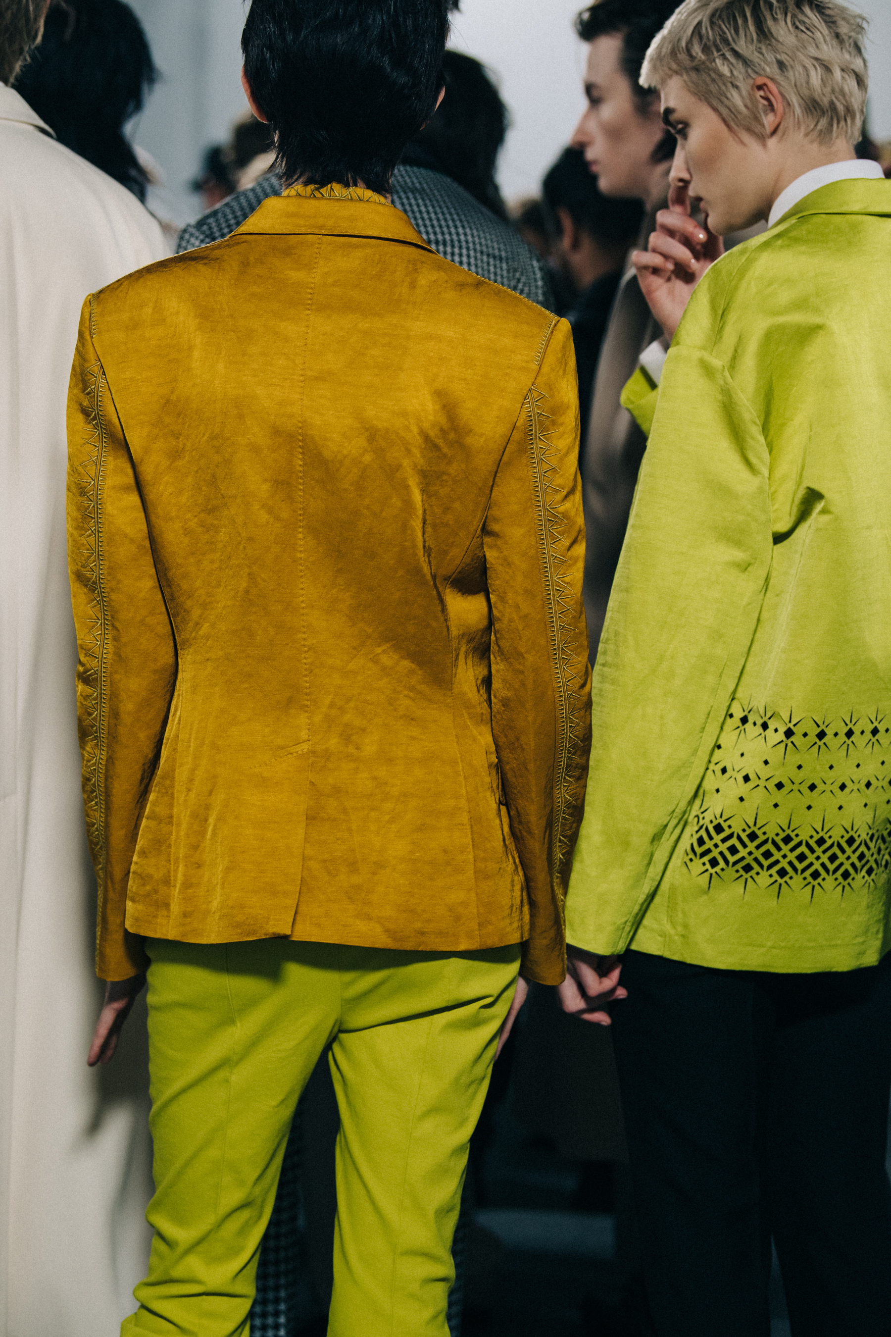Models wearing yellow Haider Ackermann outfit