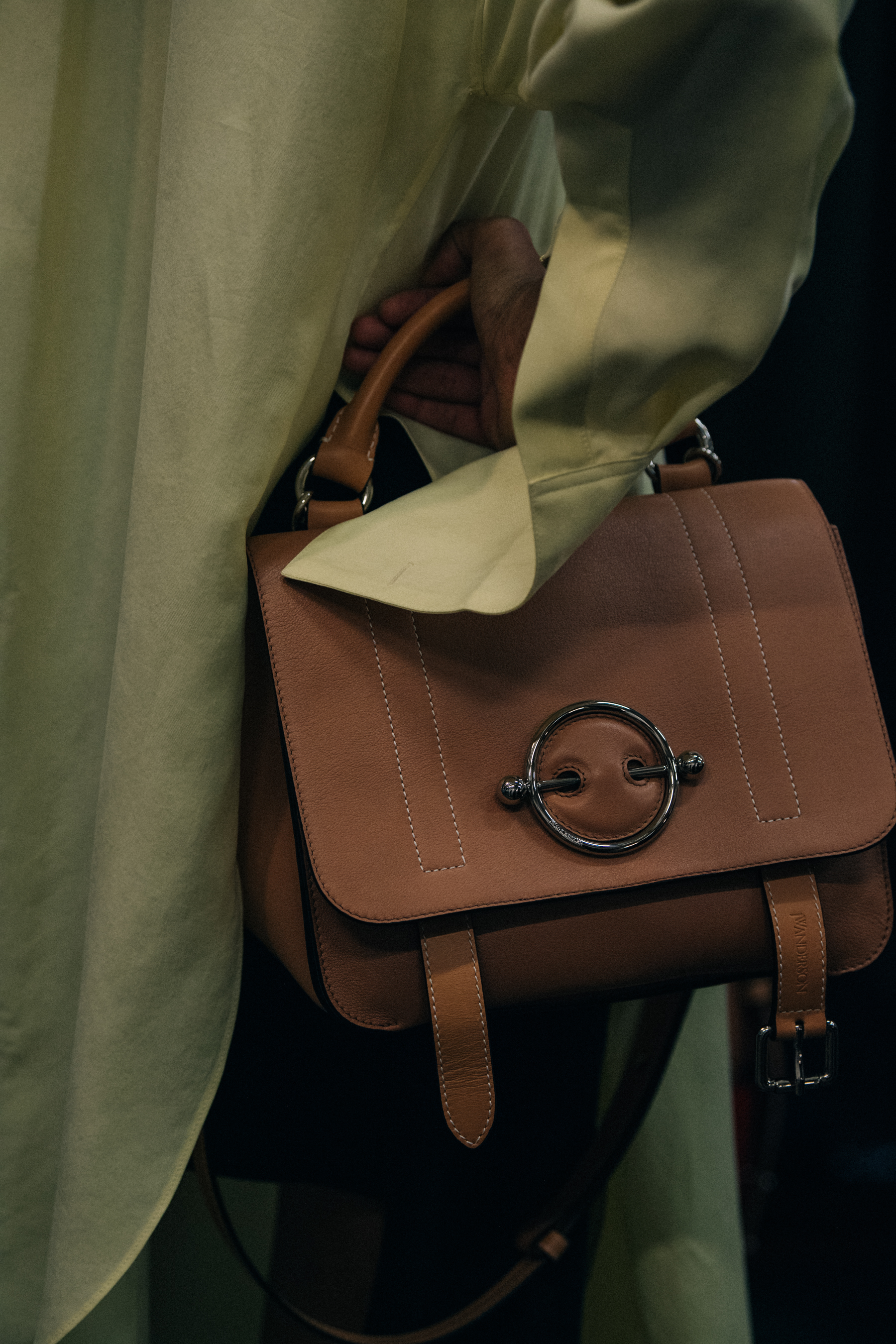 Models carrying bags at JW Anderson