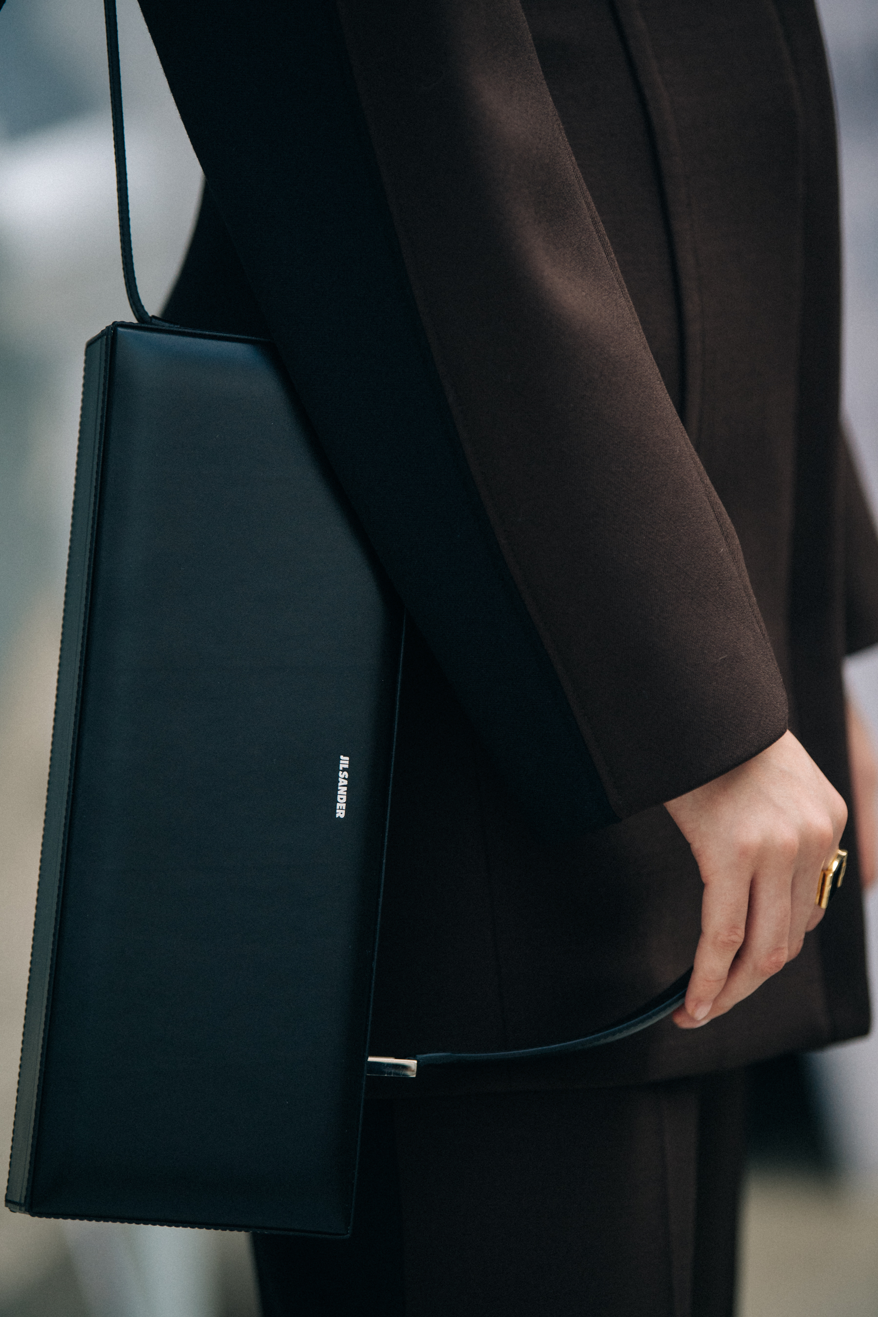 Model wearing brown Jil Sander outfit