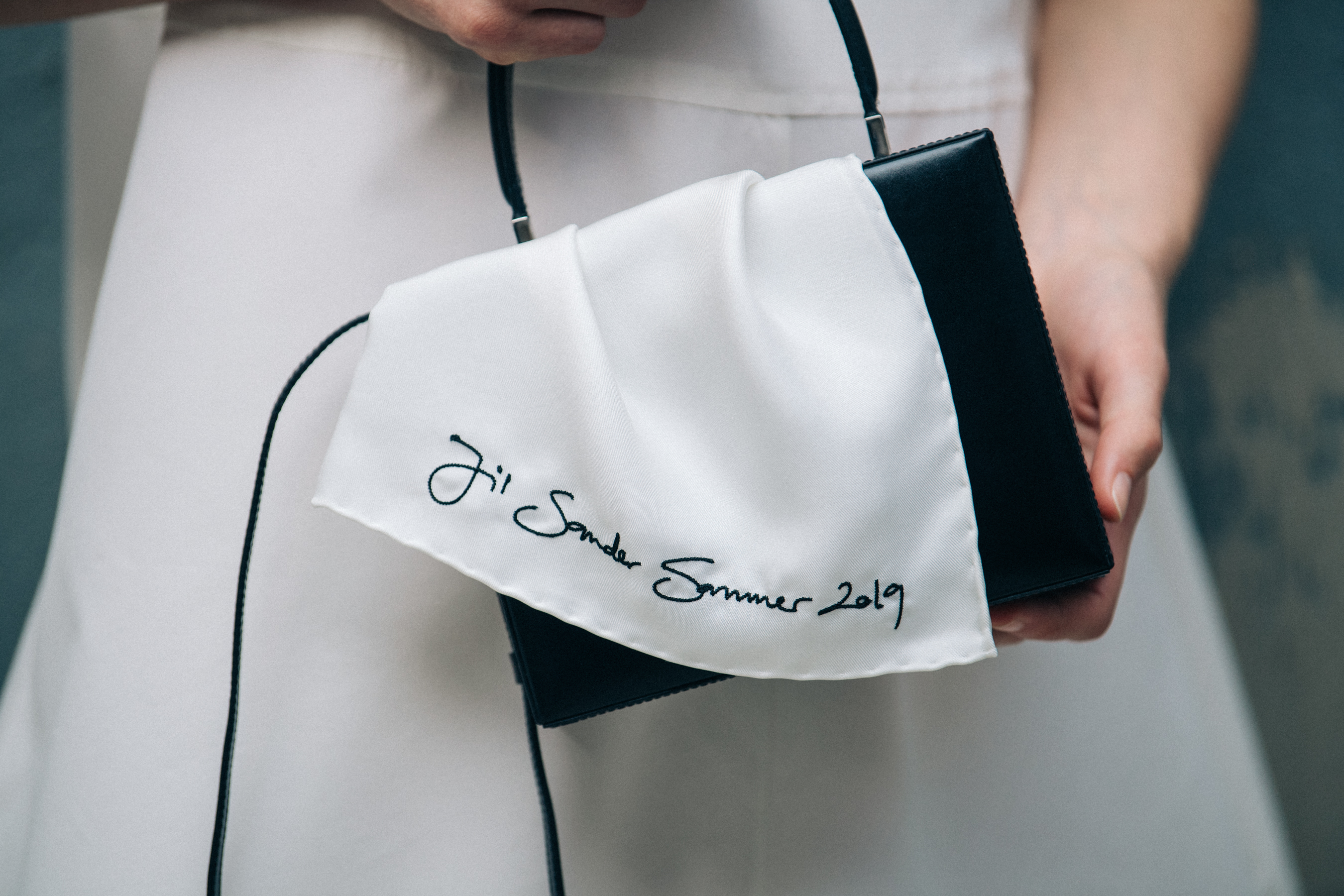 Model wearing white Jil Sander outfit