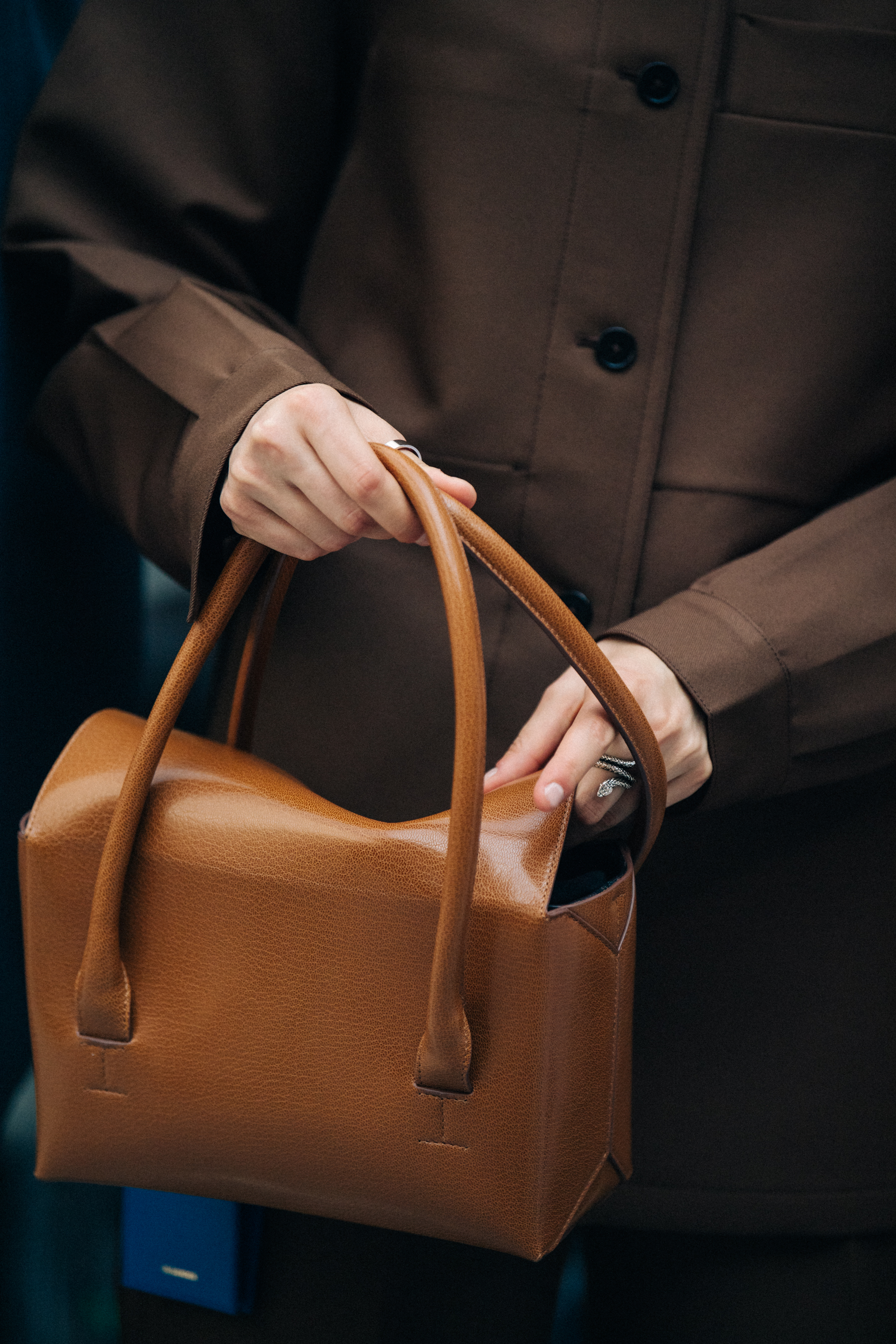 Model wearing brown Jil Sander outfit