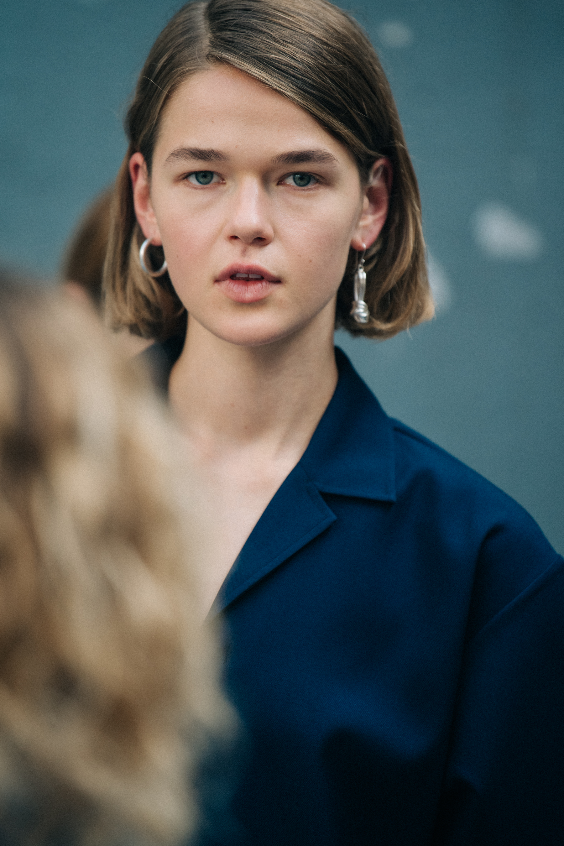 Model wearing blue Jil Sander outfit