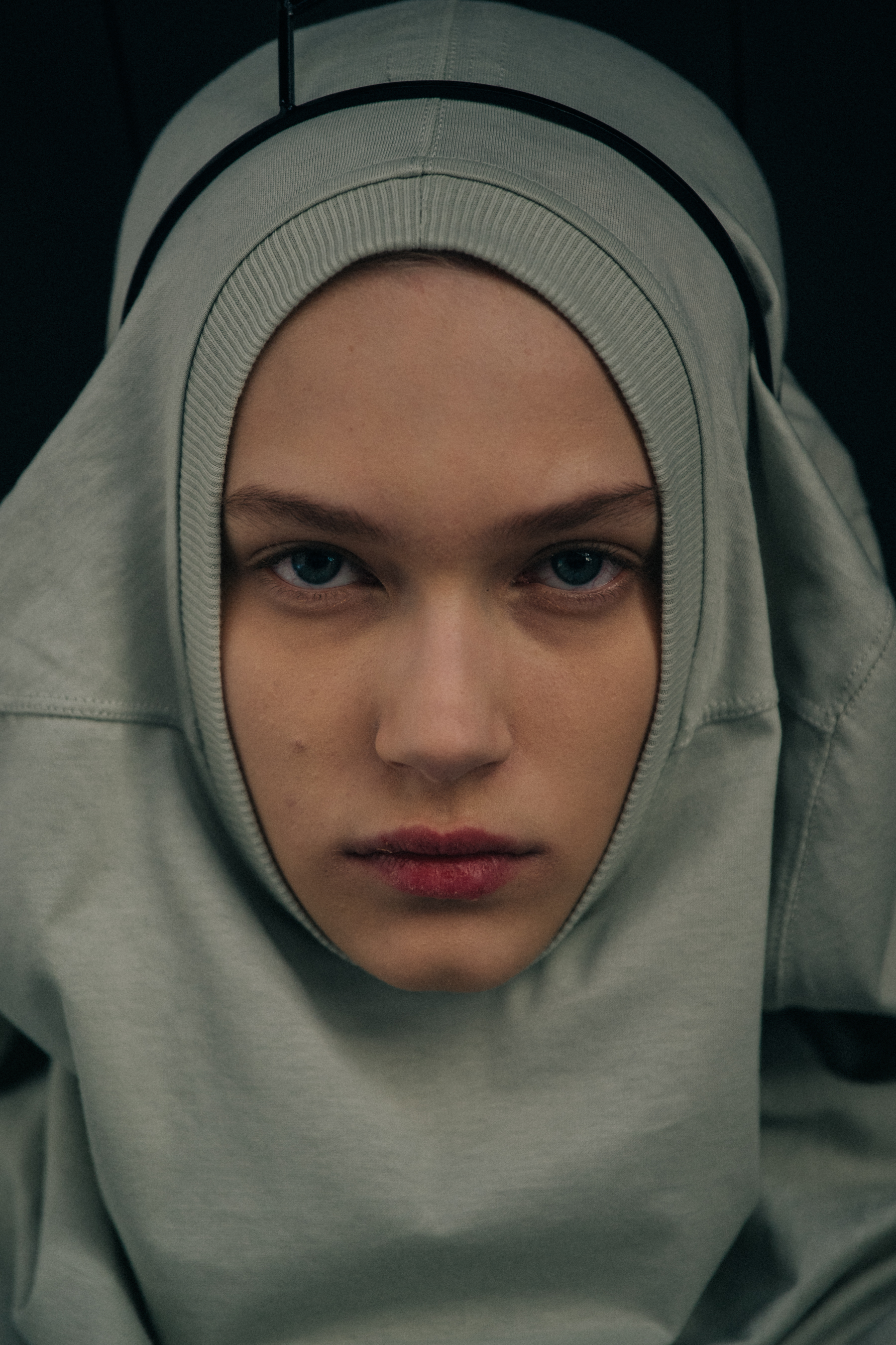 Portrait of model wearign grey hoodie