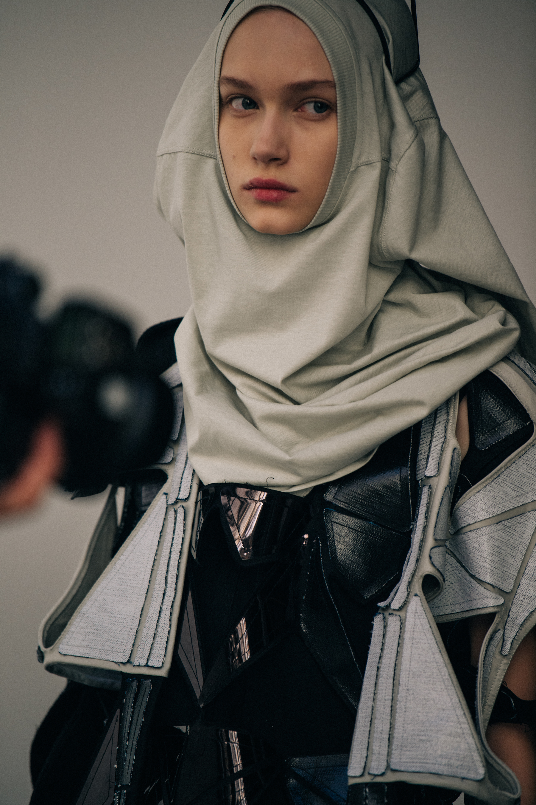 Model wearing grey hoodie at Rick Owens