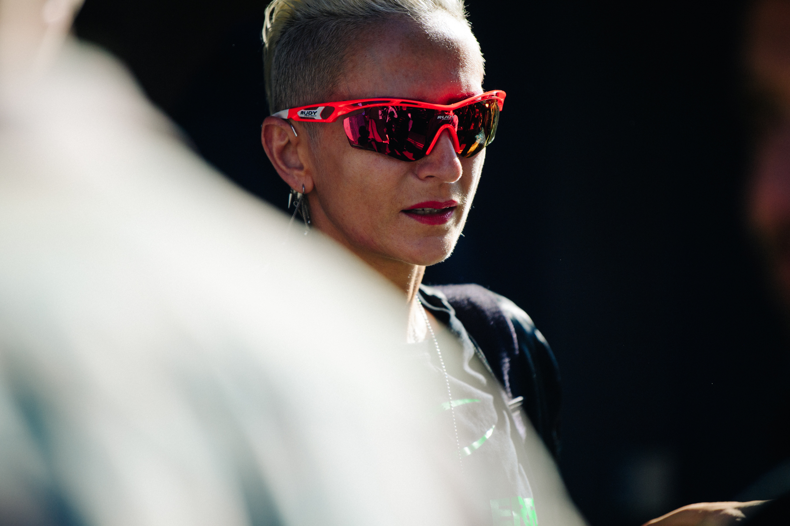 Woman wearing red sports glasses
